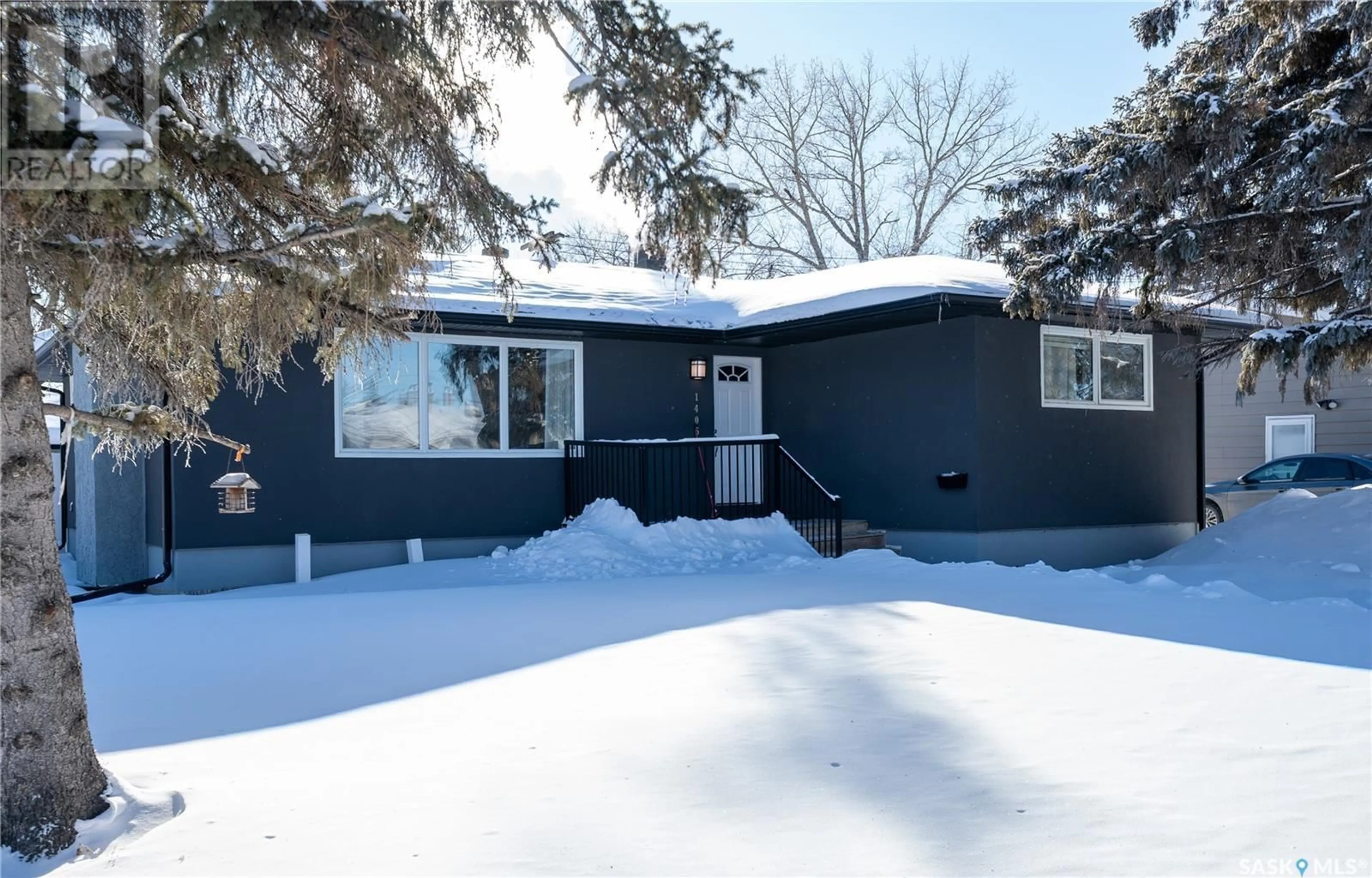 Home with vinyl exterior material, street for 1405 Macpherson AVENUE, Regina Saskatchewan S4S4E1