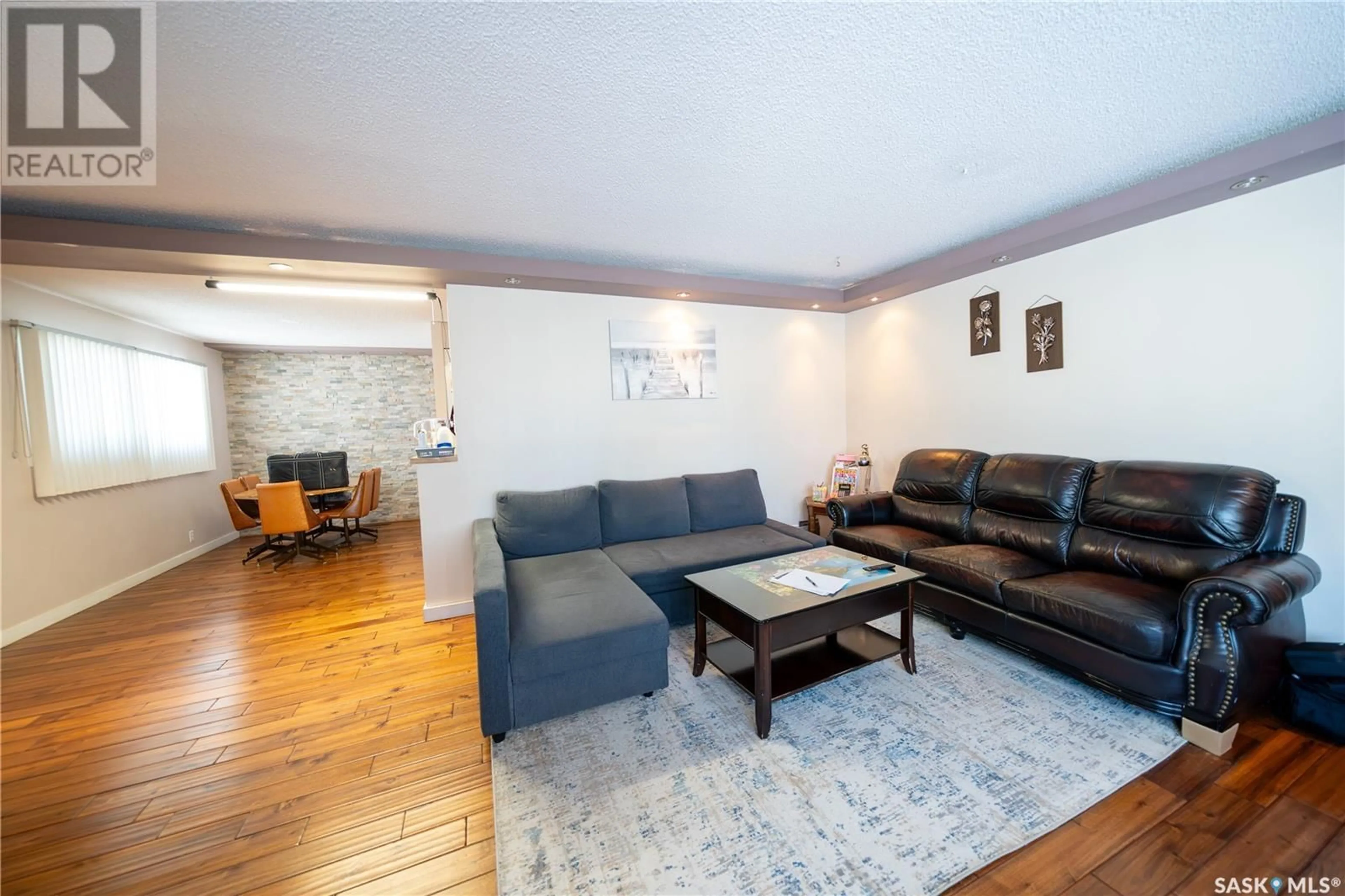 Living room with furniture, wood/laminate floor for 1405 Macpherson AVENUE, Regina Saskatchewan S4S4E1