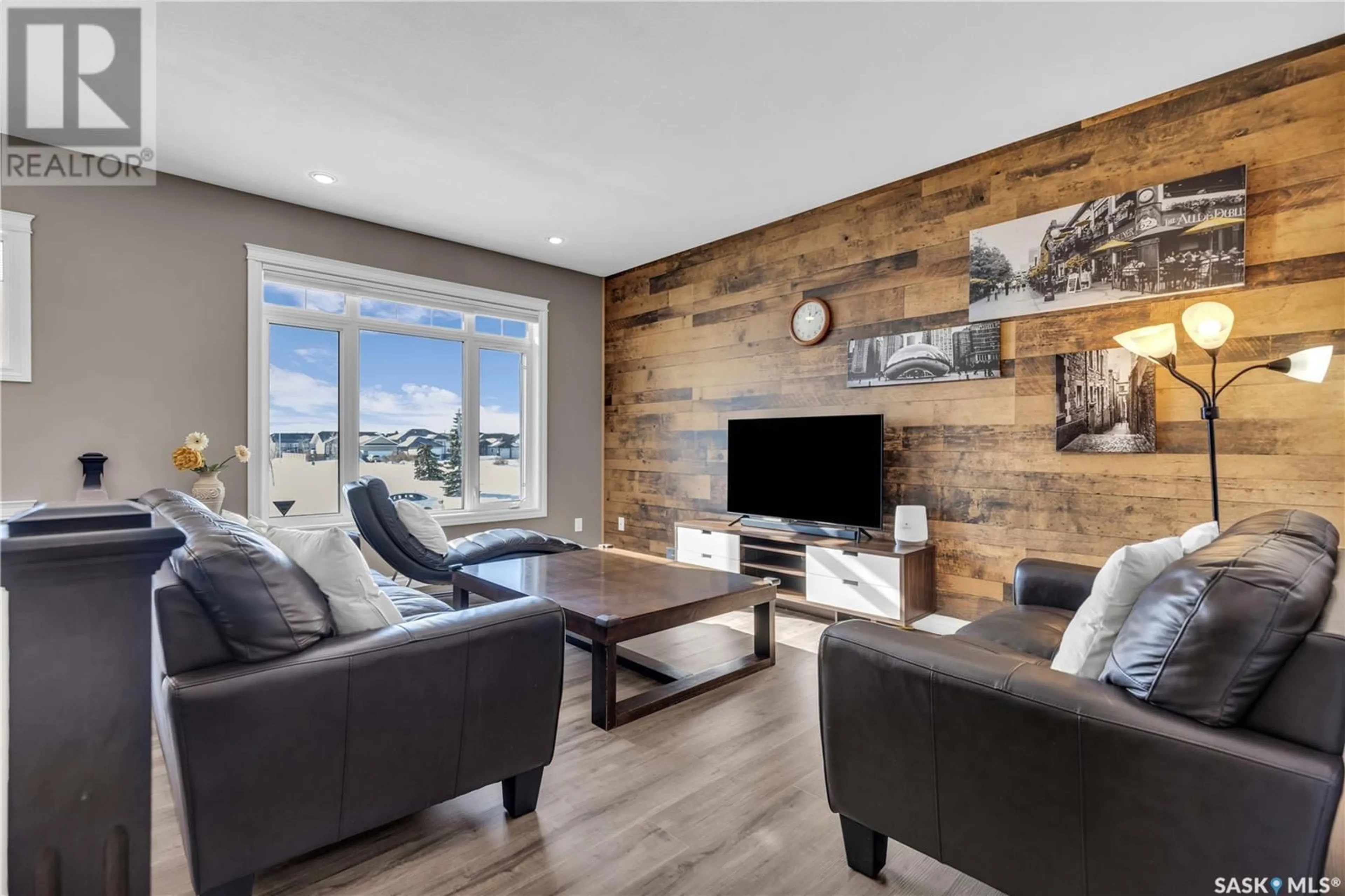 Living room with furniture, wood/laminate floor for 410 Player CRESCENT, Warman Saskatchewan S0K0A1