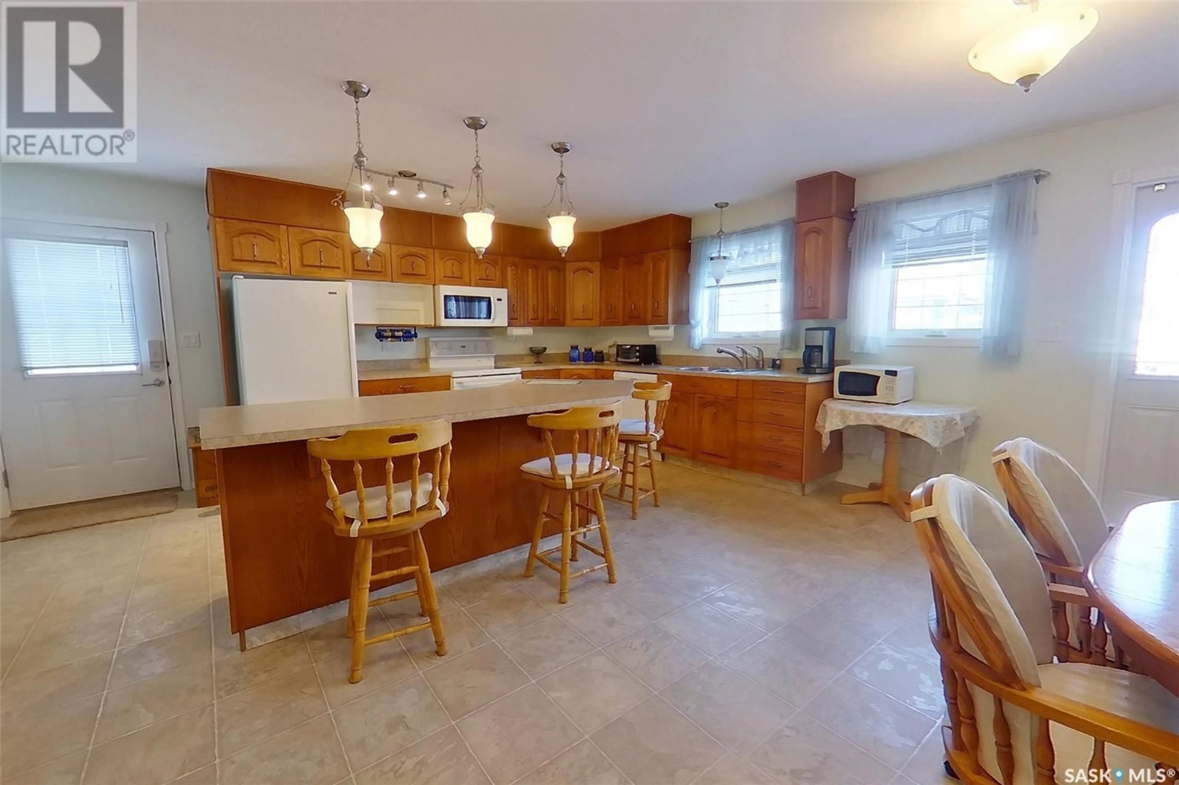 Open concept kitchen, ceramic/tile floor for 916 103RD AVENUE, Tisdale Saskatchewan S0E1T0