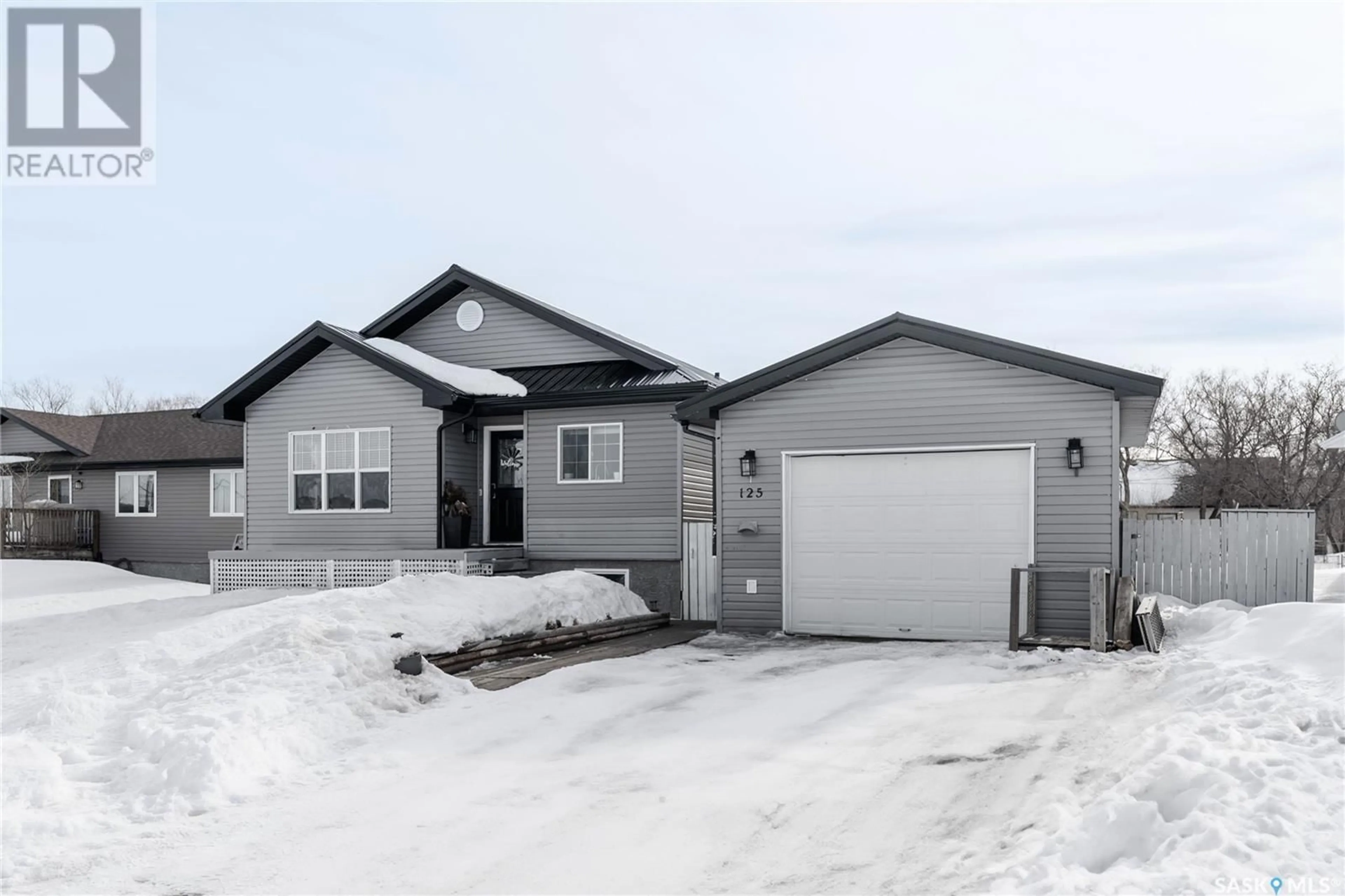 Home with vinyl exterior material, street for 125 Rouleau STREET, Wilcox Saskatchewan S0G5E0