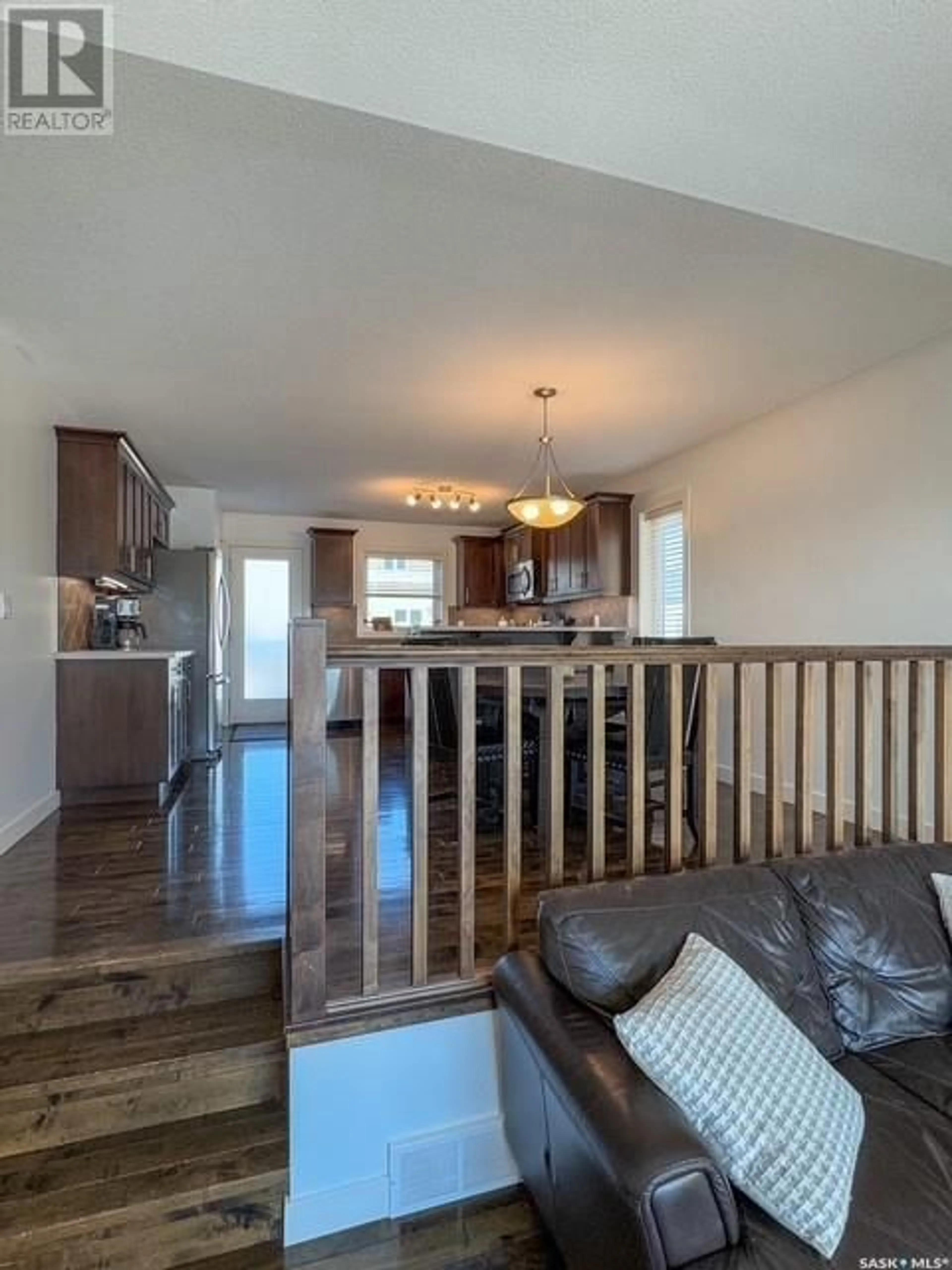 Open concept kitchen, wood/laminate floor for 121 Valley Park PLACE, Swift Current Saskatchewan S9H5N2