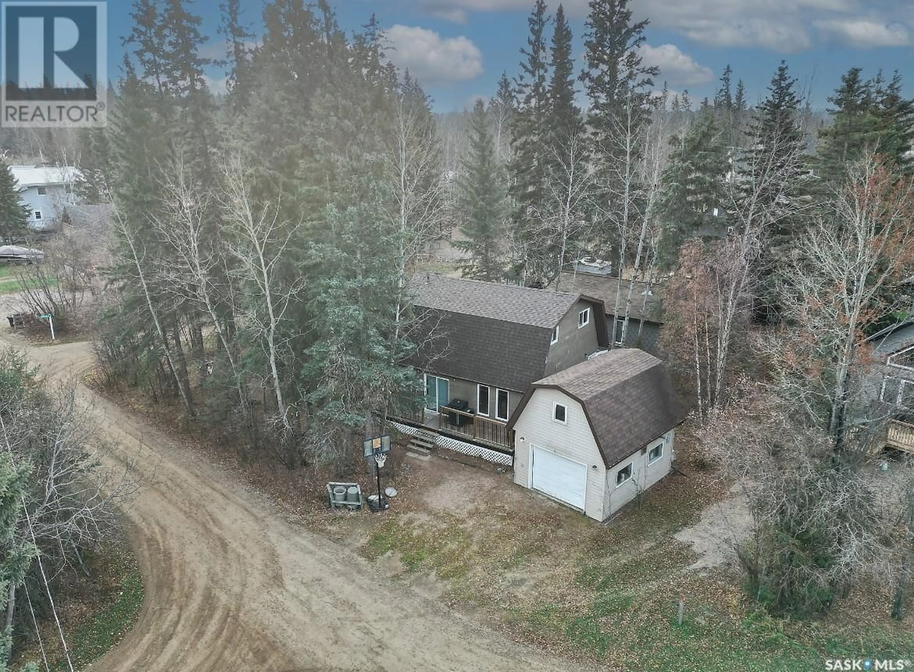 A pic from outside/outdoor area/front of a property/back of a property/a pic from drone, forest/trees view for 2 3rd CRESCENT, Candle Lake Saskatchewan S0J3E0