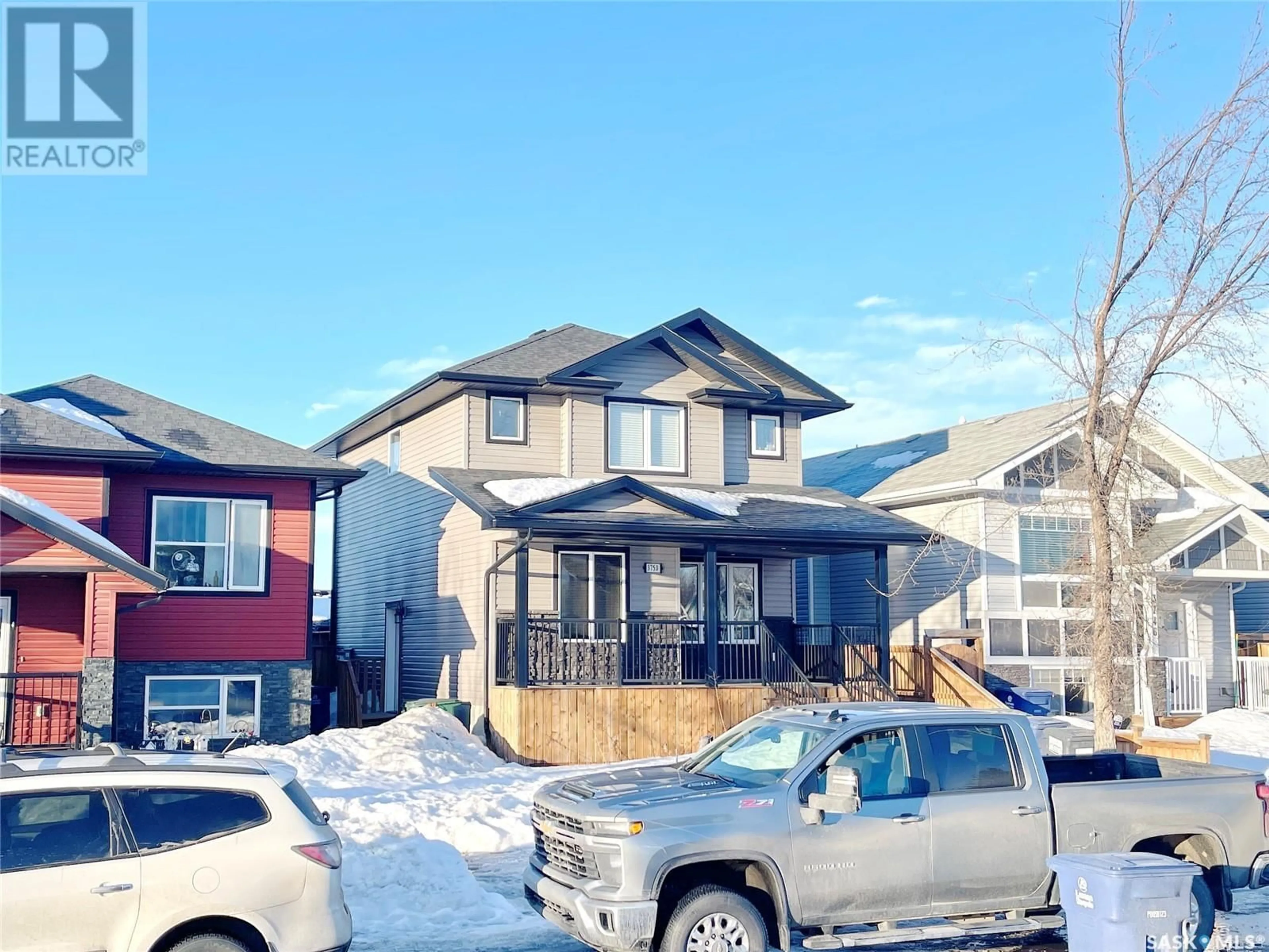 Home with vinyl exterior material, street for 3750 33rd STREET W, Saskatoon Saskatchewan S7R0M1