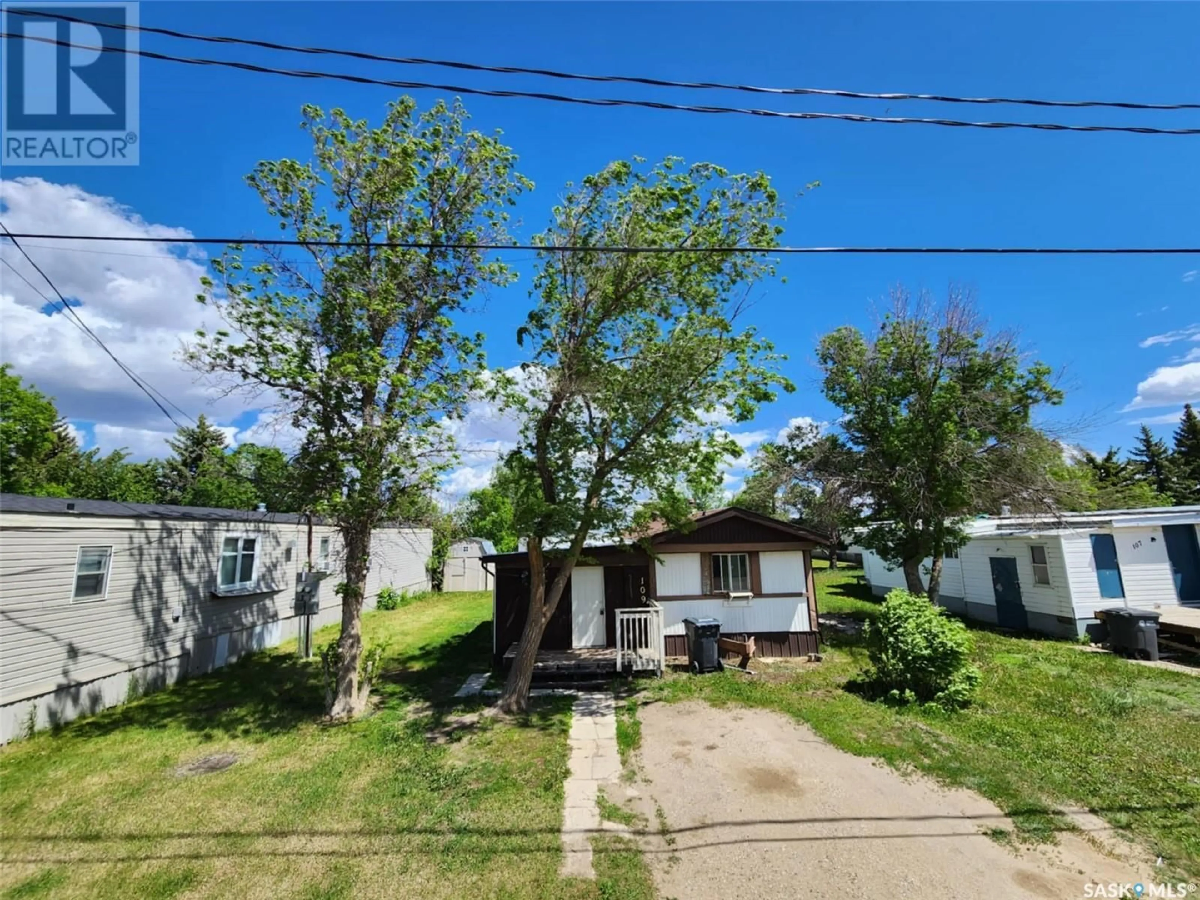 A pic from outside/outdoor area/front of a property/back of a property/a pic from drone, street for 109 Larch STREET, Caronport Saskatchewan S0H0S0