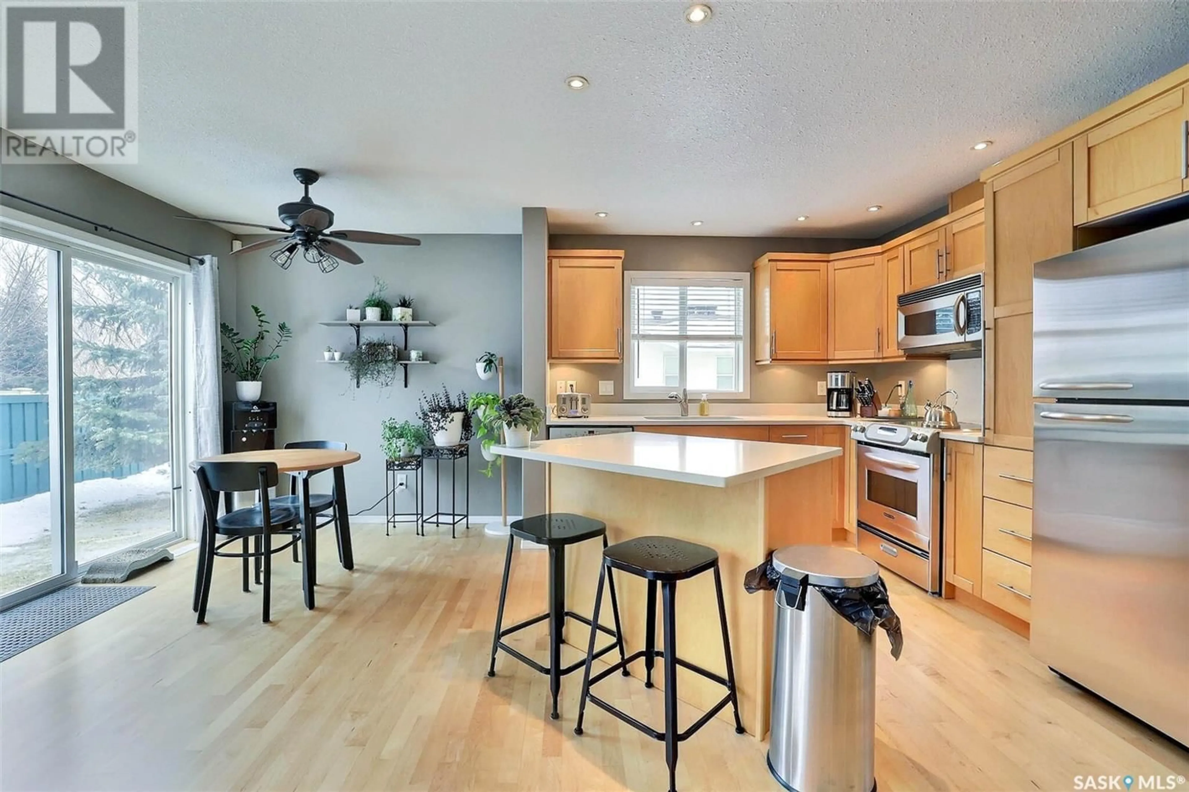 Open concept kitchen, wood/laminate floor for 7 2801 Windsor Park ROAD, Regina Saskatchewan S4V0M9