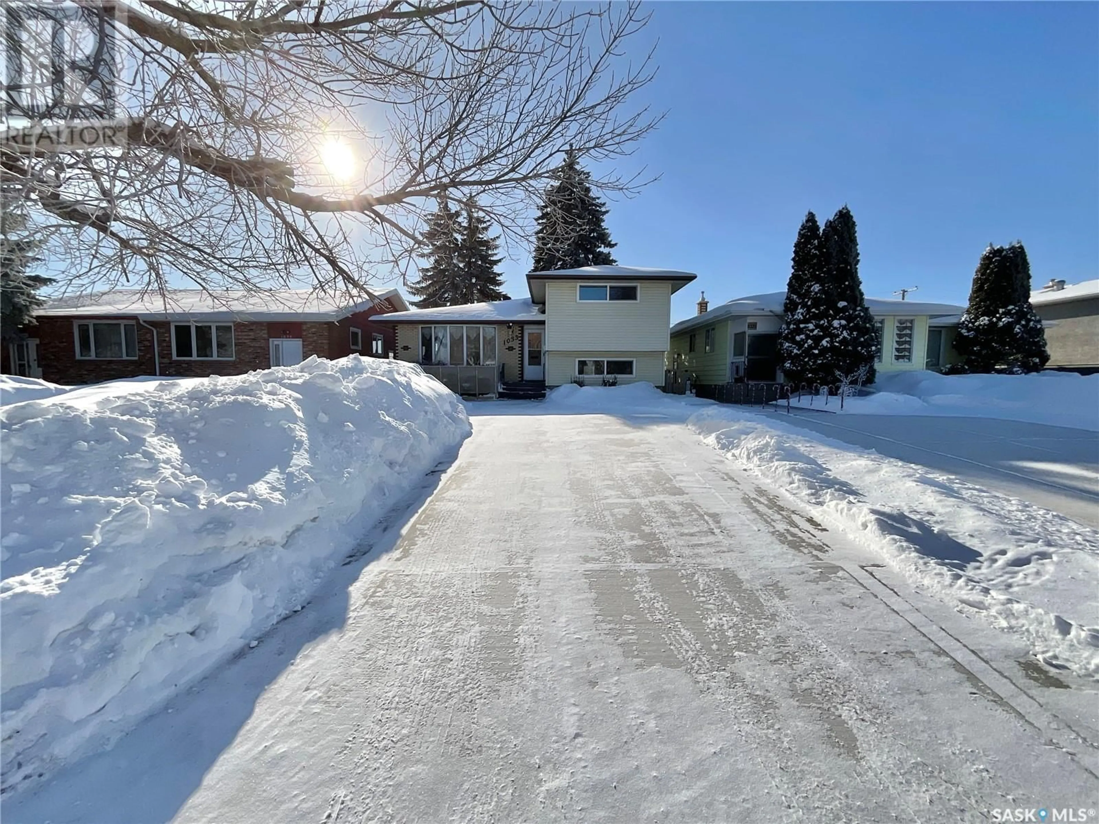 A pic from outside/outdoor area/front of a property/back of a property/a pic from drone, street for 1033 12th AVENUE E, Regina Saskatchewan S4N4W1