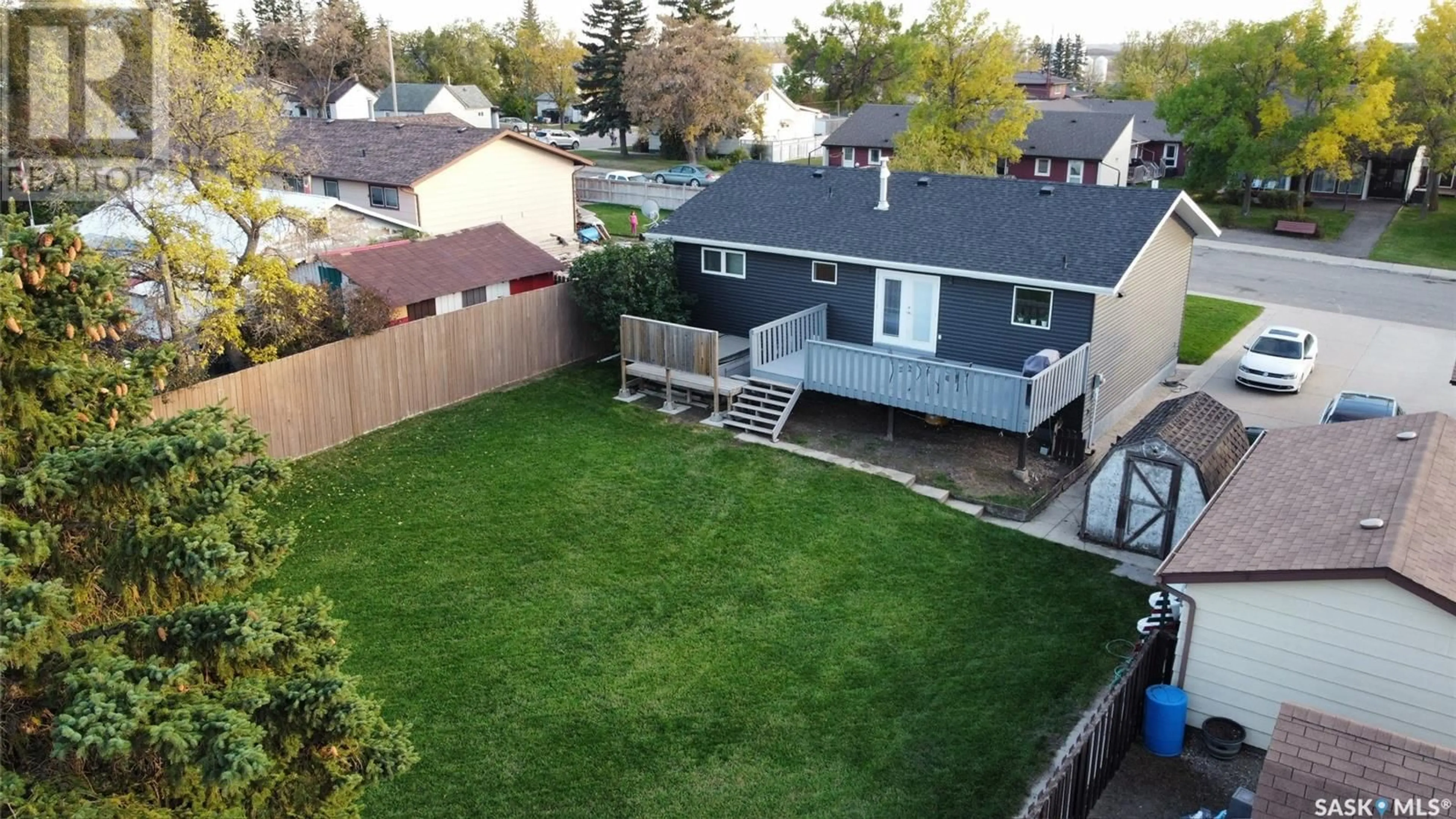 A pic from outside/outdoor area/front of a property/back of a property/a pic from drone, street for 405 3rd AVENUE W, Biggar Saskatchewan S0K0M0