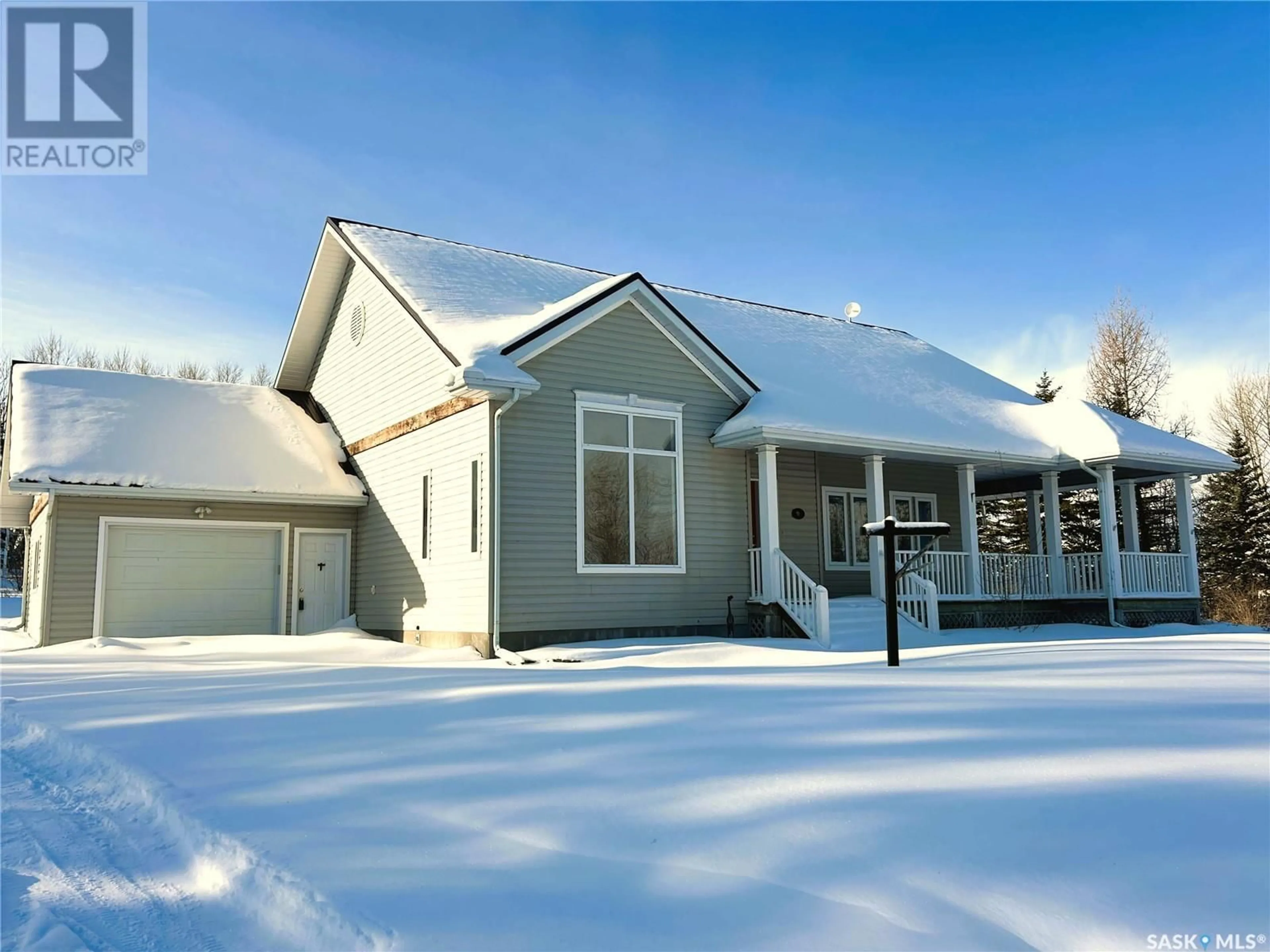 Home with vinyl exterior material, street for WAKAW LAKE ACREAGE, Hoodoo Rm No. 401 Saskatchewan S0K4P0