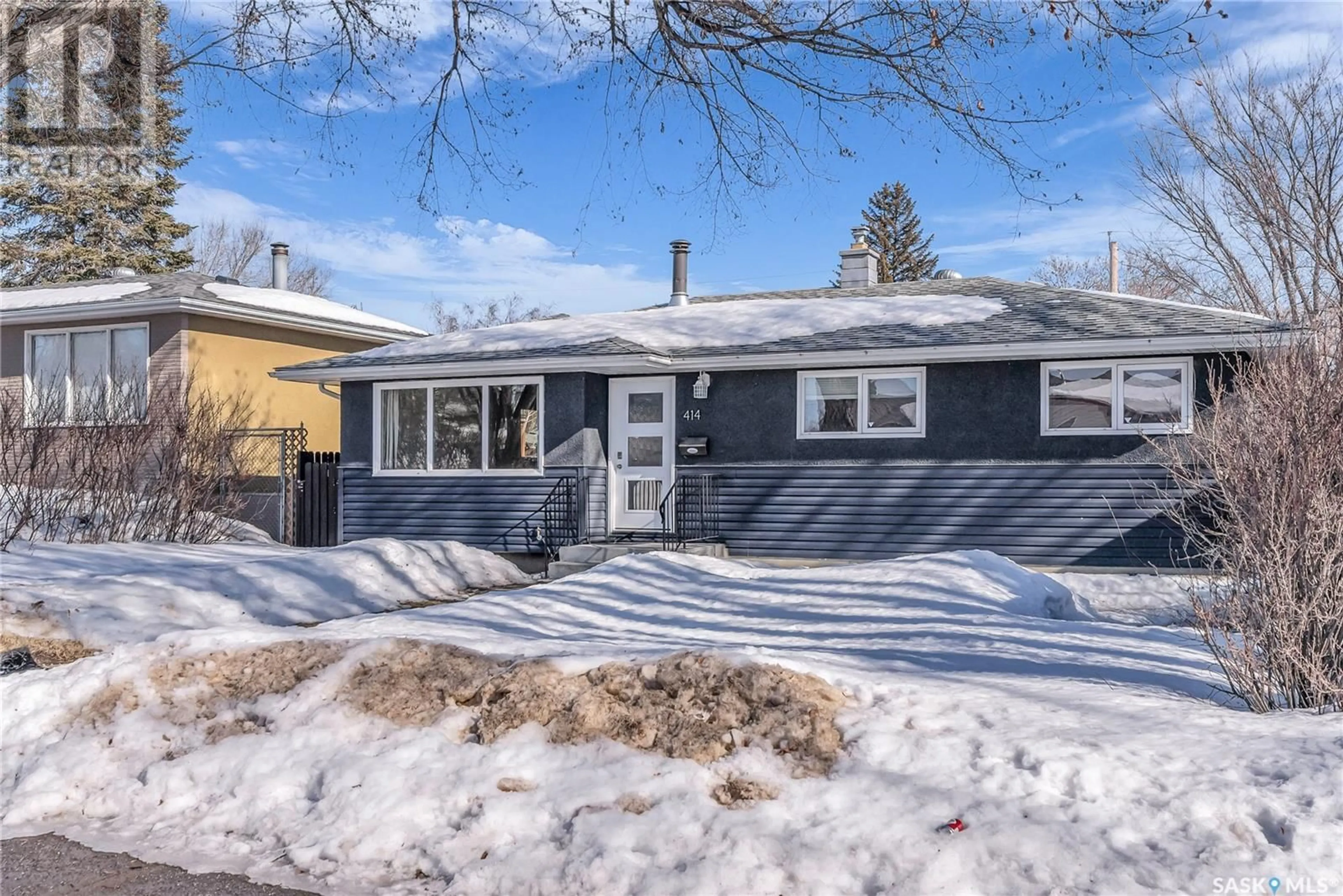 Home with vinyl exterior material, street for 414 Montreal AVENUE S, Saskatoon Saskatchewan S7M3L3