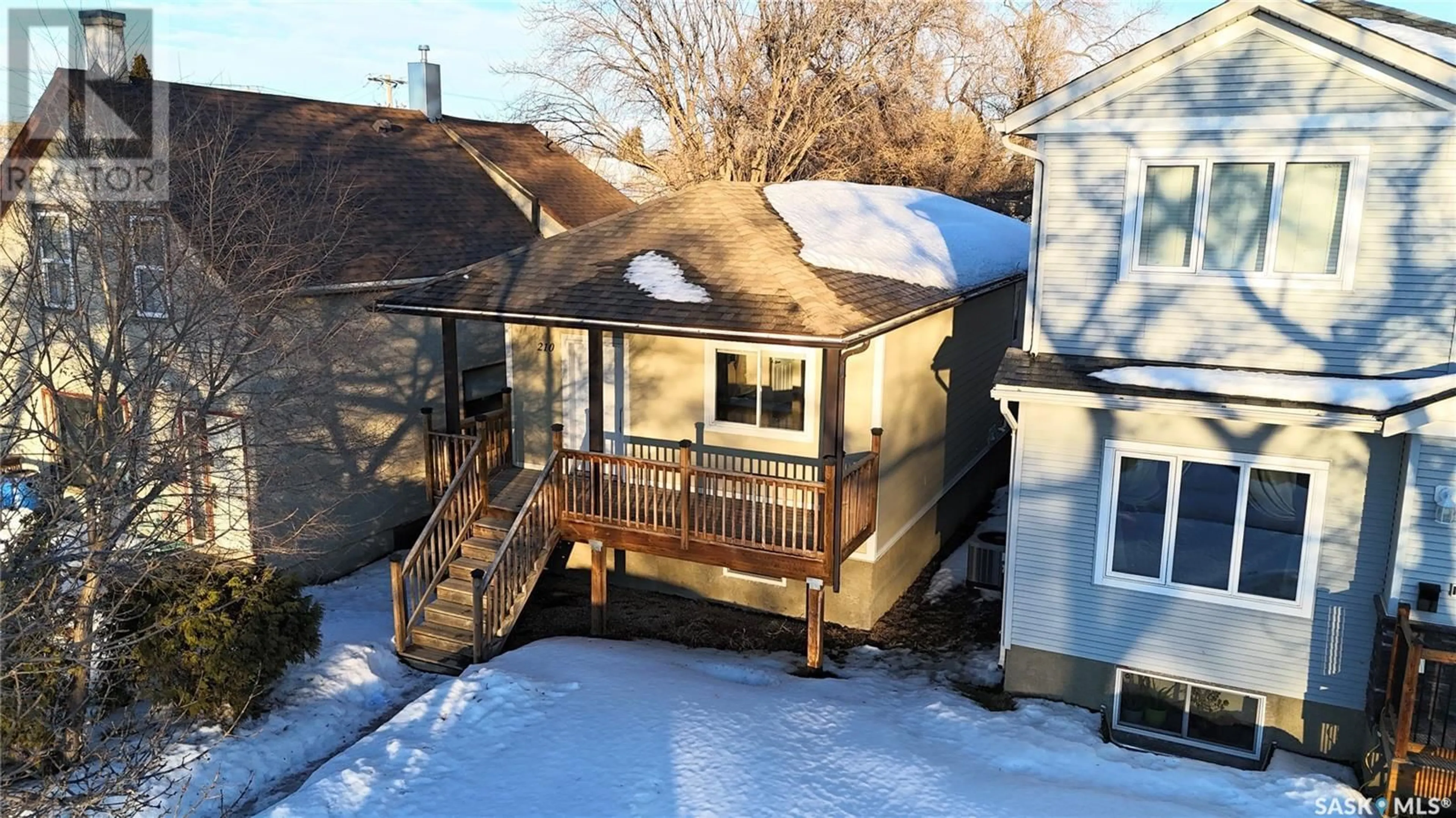 A pic from outside/outdoor area/front of a property/back of a property/a pic from drone, street for 210 G AVENUE S, Saskatoon Saskatchewan S7M1V1