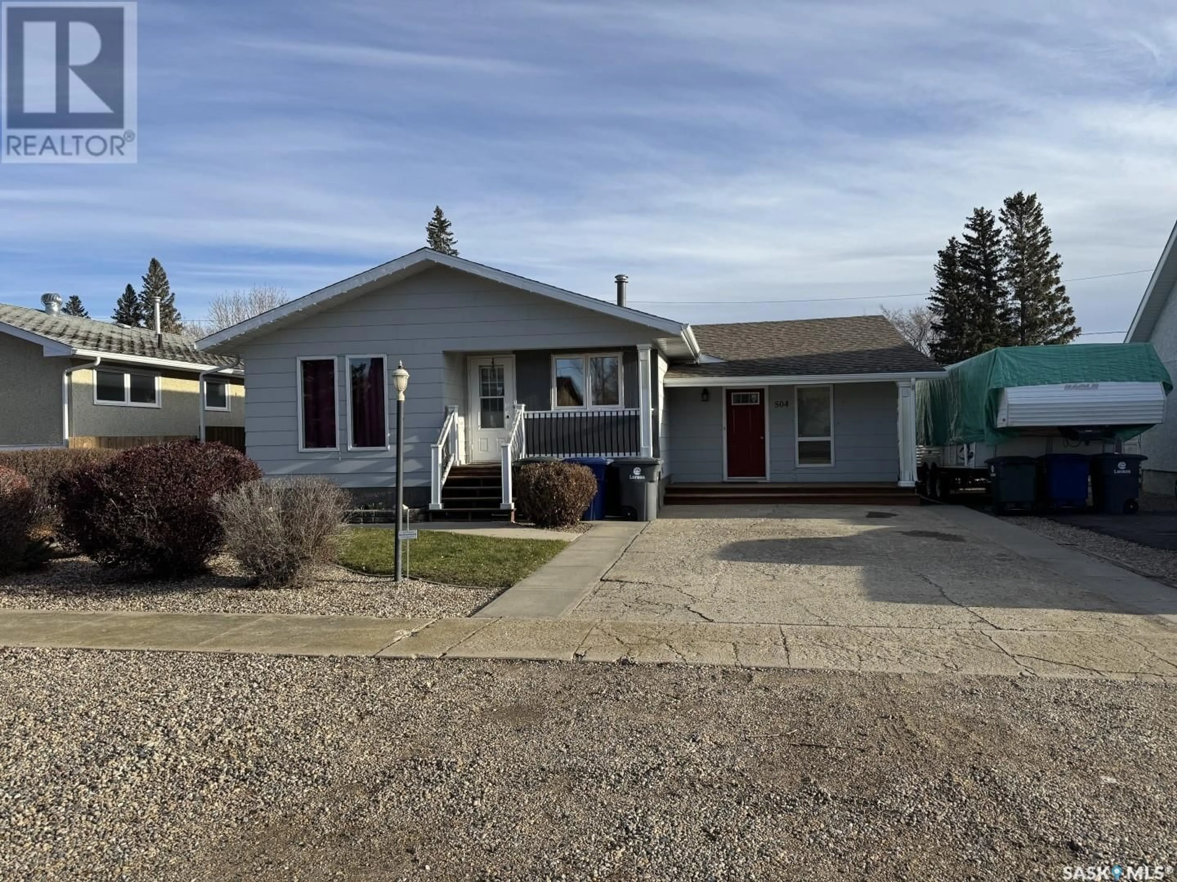 Home with vinyl exterior material, street for 504 2nd STREET W, Wilkie Saskatchewan S0K4W0