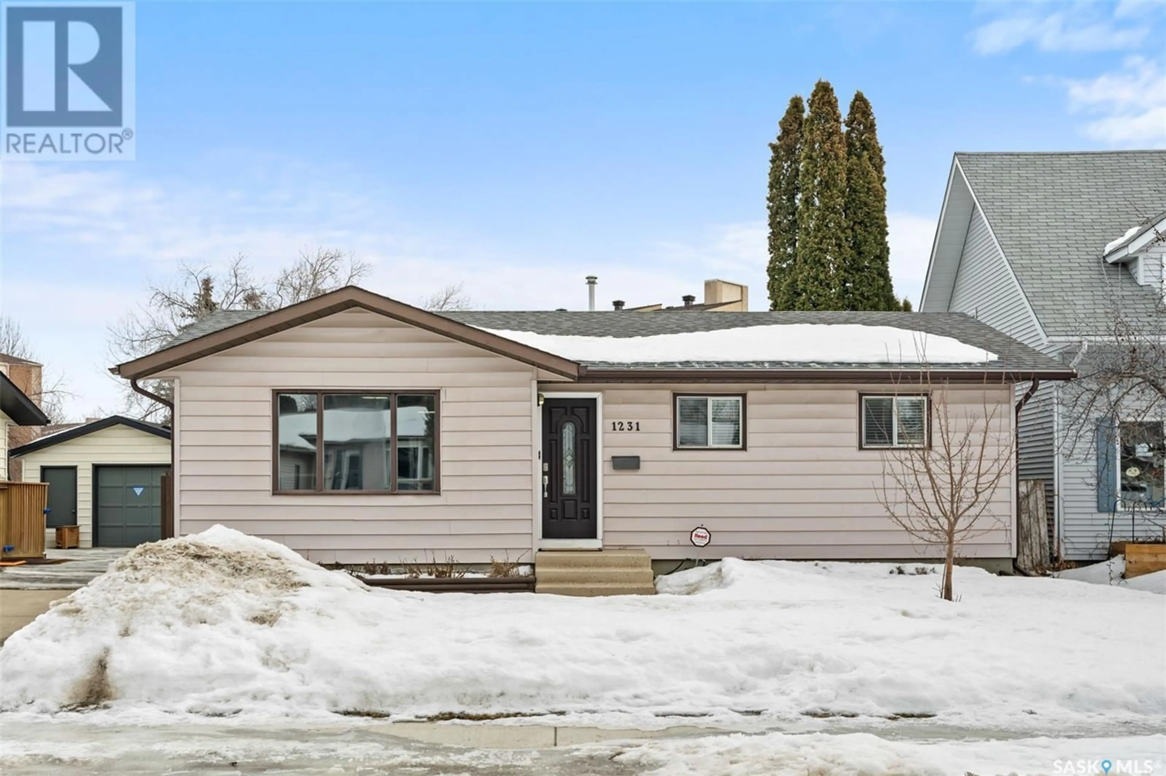 Home with vinyl exterior material, street for 1231 Emerald CRESCENT, Saskatoon Saskatchewan S7J4J2