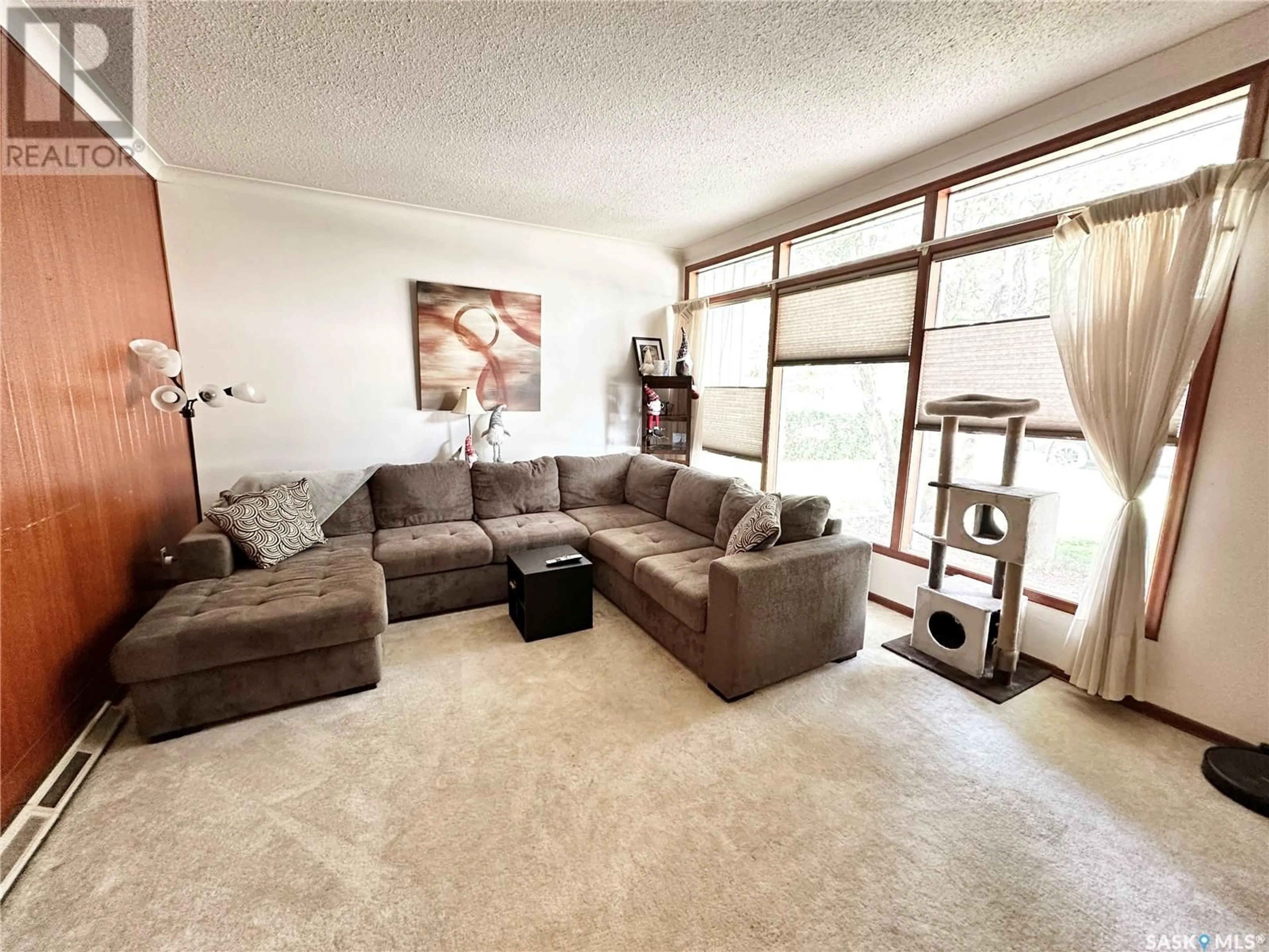 Living room with furniture, unknown for 220 Ash DRIVE, Weyburn Saskatchewan S4H0S2