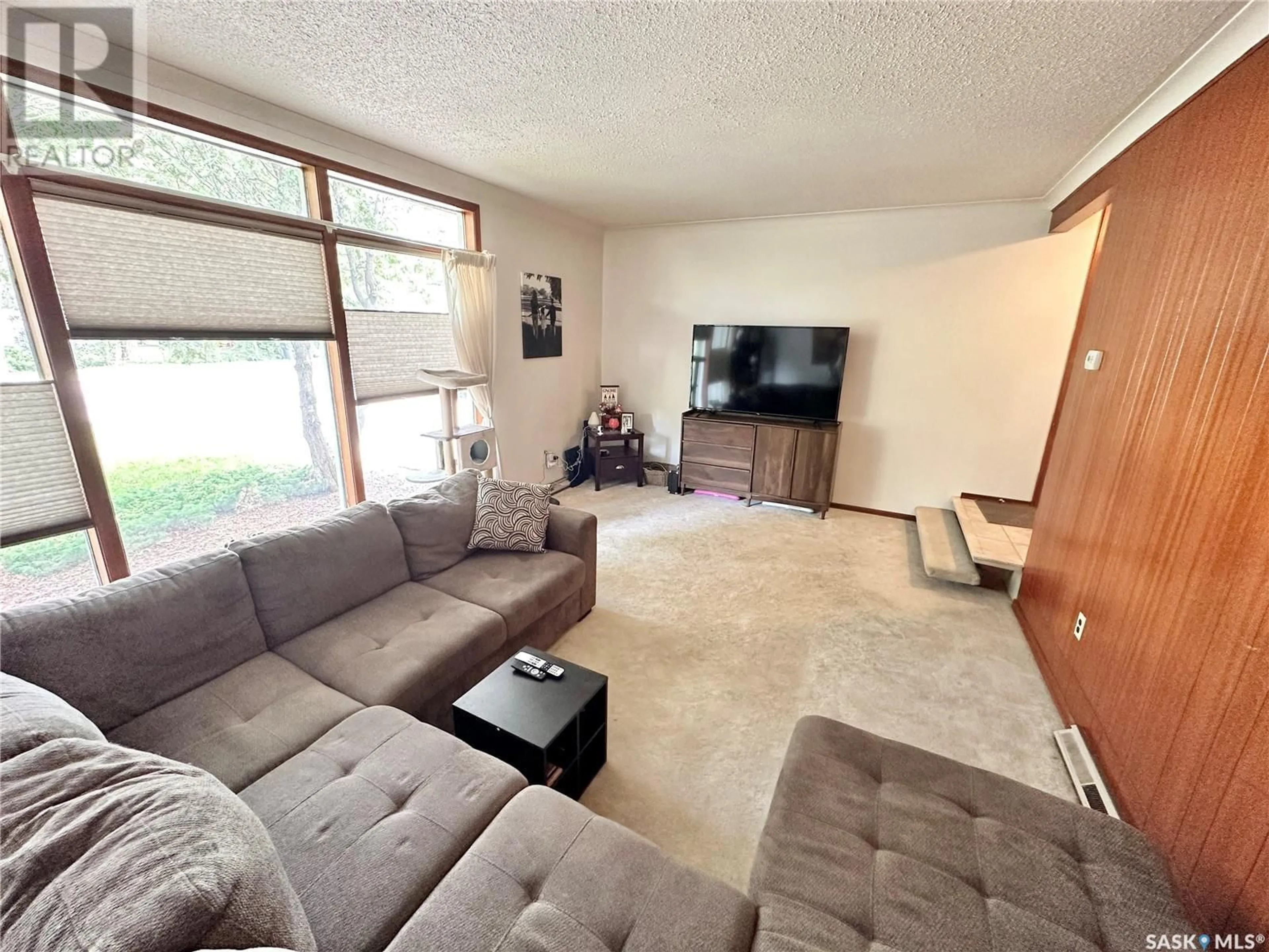 Living room with furniture, unknown for 220 Ash DRIVE, Weyburn Saskatchewan S4H0S2