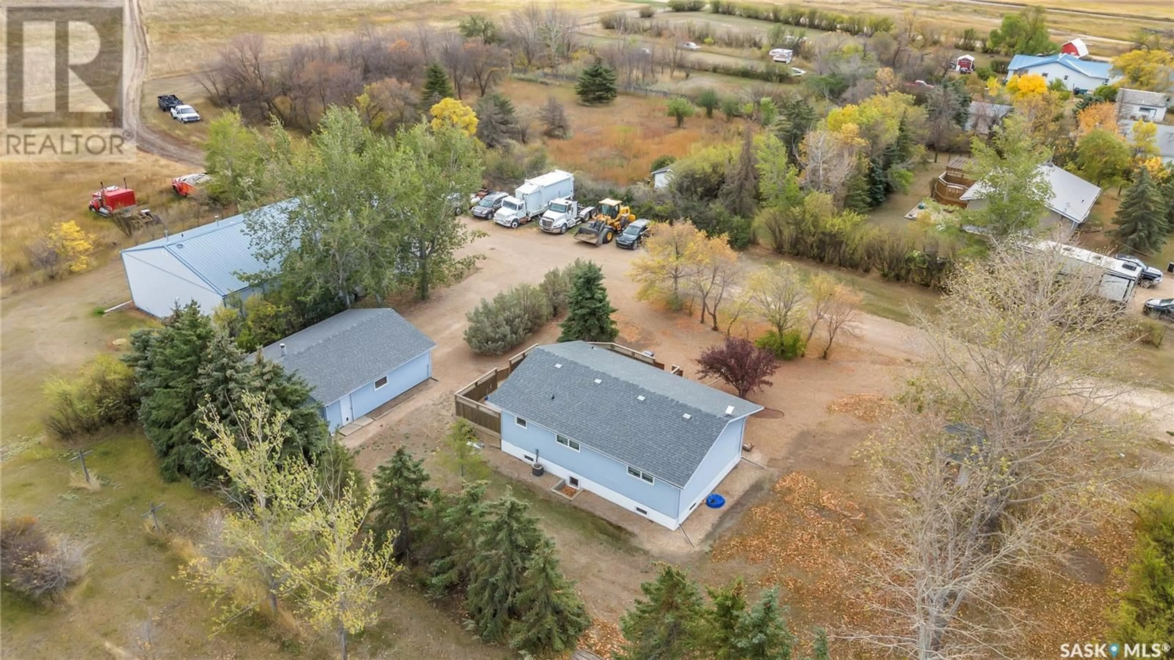 A pic from outside/outdoor area/front of a property/back of a property/a pic from drone, forest/trees view for 901 Connaught AVENUE, Limerick Saskatchewan S0H2P0