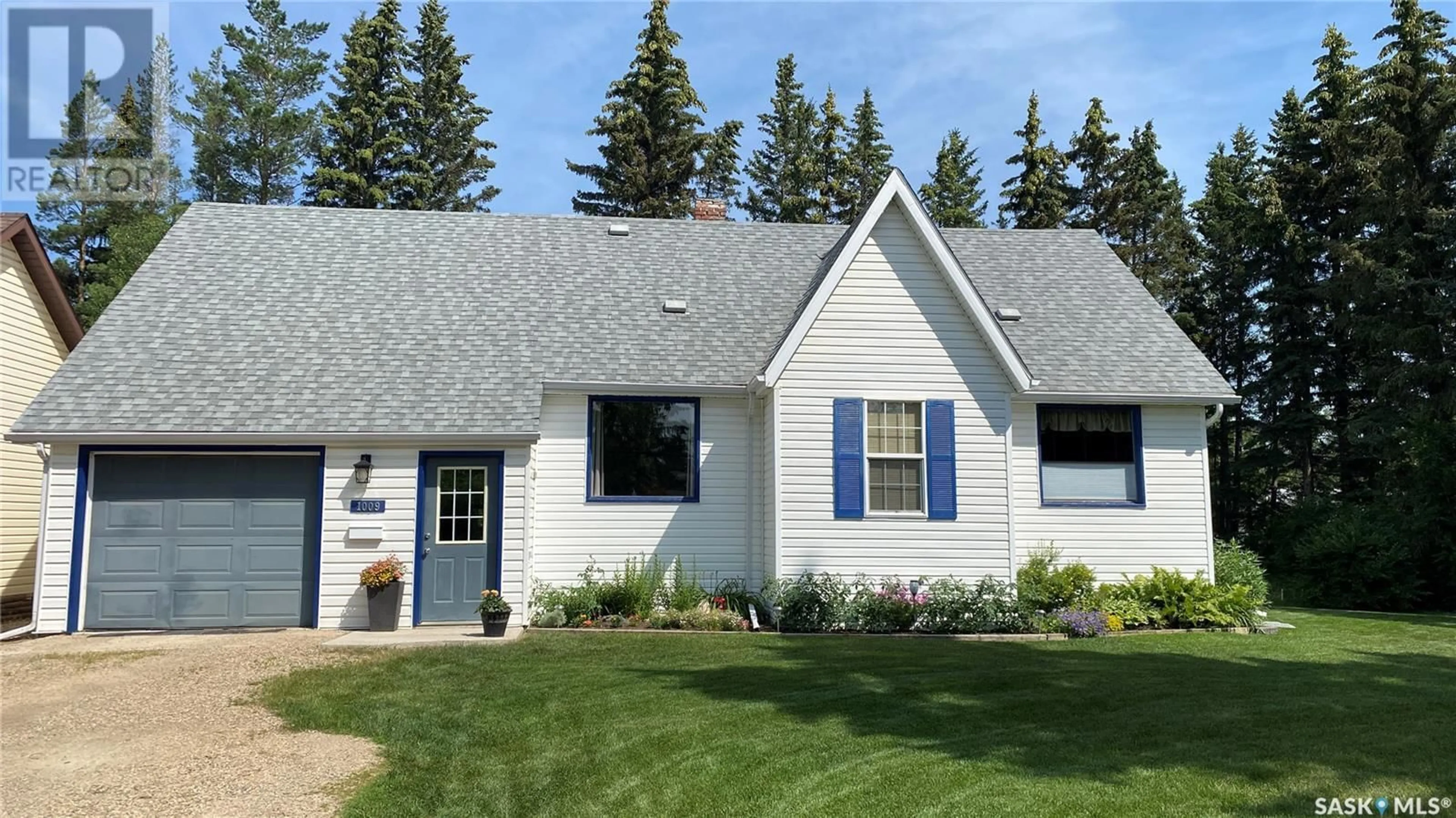 Home with vinyl exterior material, street for 1007 110th AVENUE, Tisdale Saskatchewan S0E1T0