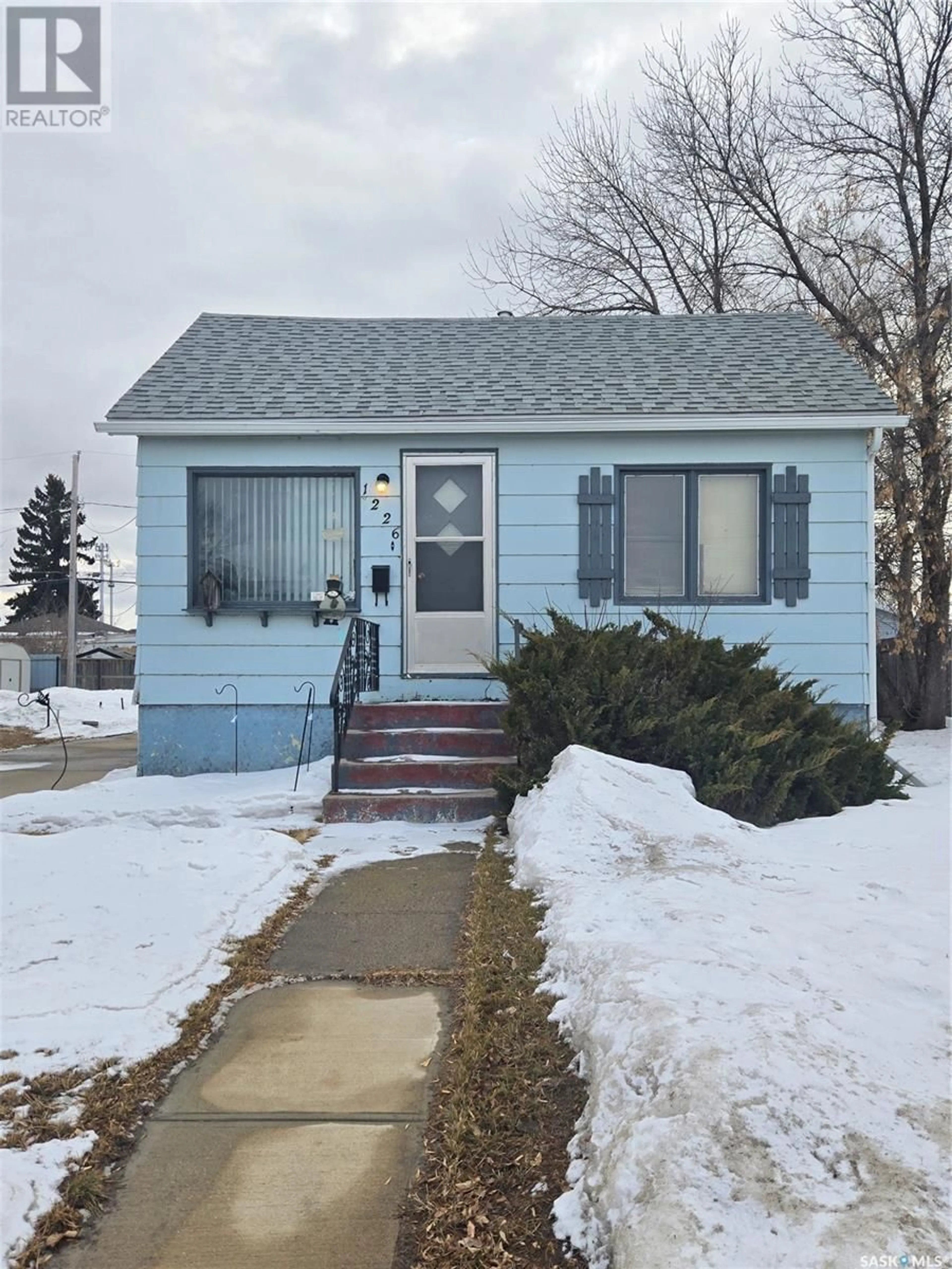Home with vinyl exterior material, street for 1226 8TH STREET, Estevan Saskatchewan S4A1H3