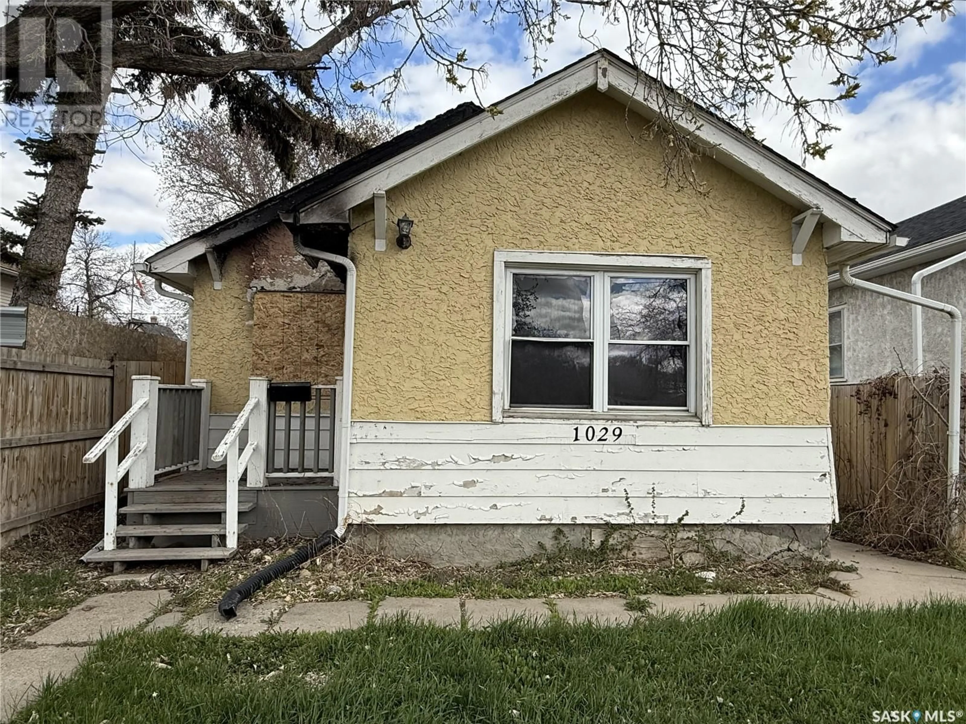 Home with vinyl exterior material, street for 1029 WASCANA STREET, Regina Saskatchewan S4T4H8