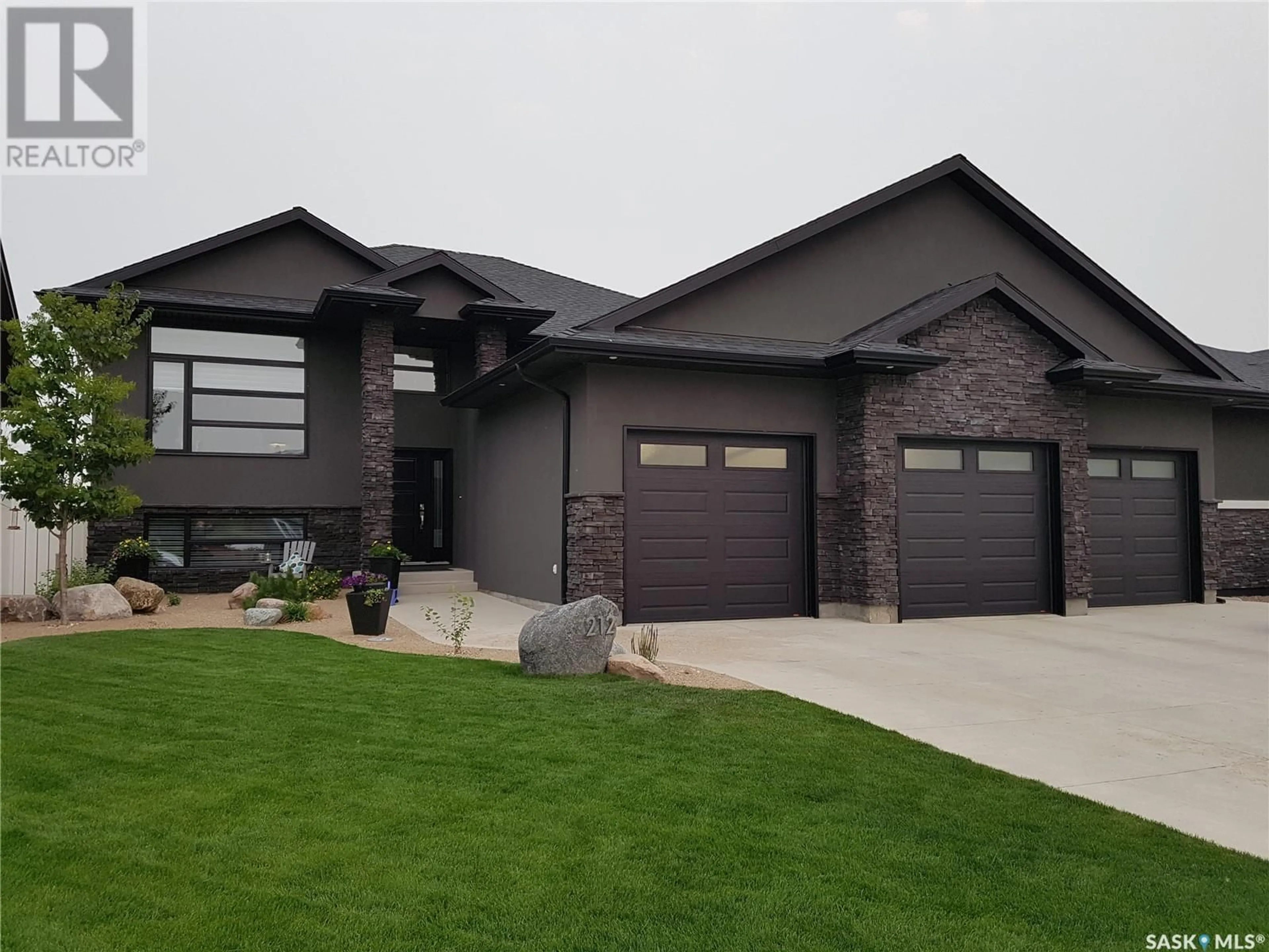 Home with brick exterior material, street for 212 Augusta DRIVE, Warman Saskatchewan S0K4S1