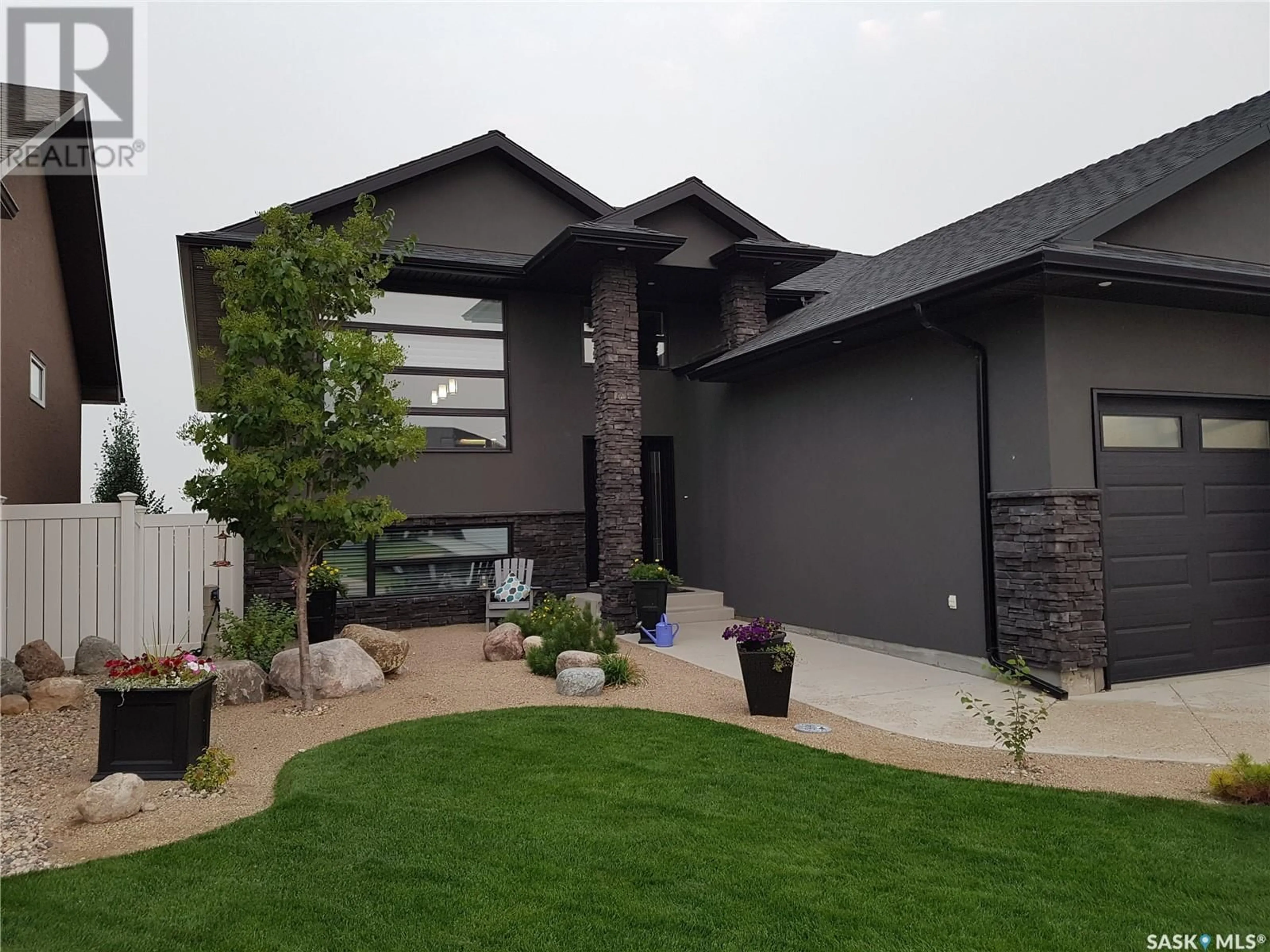 Home with vinyl exterior material, street for 212 Augusta DRIVE, Warman Saskatchewan S0K4S1