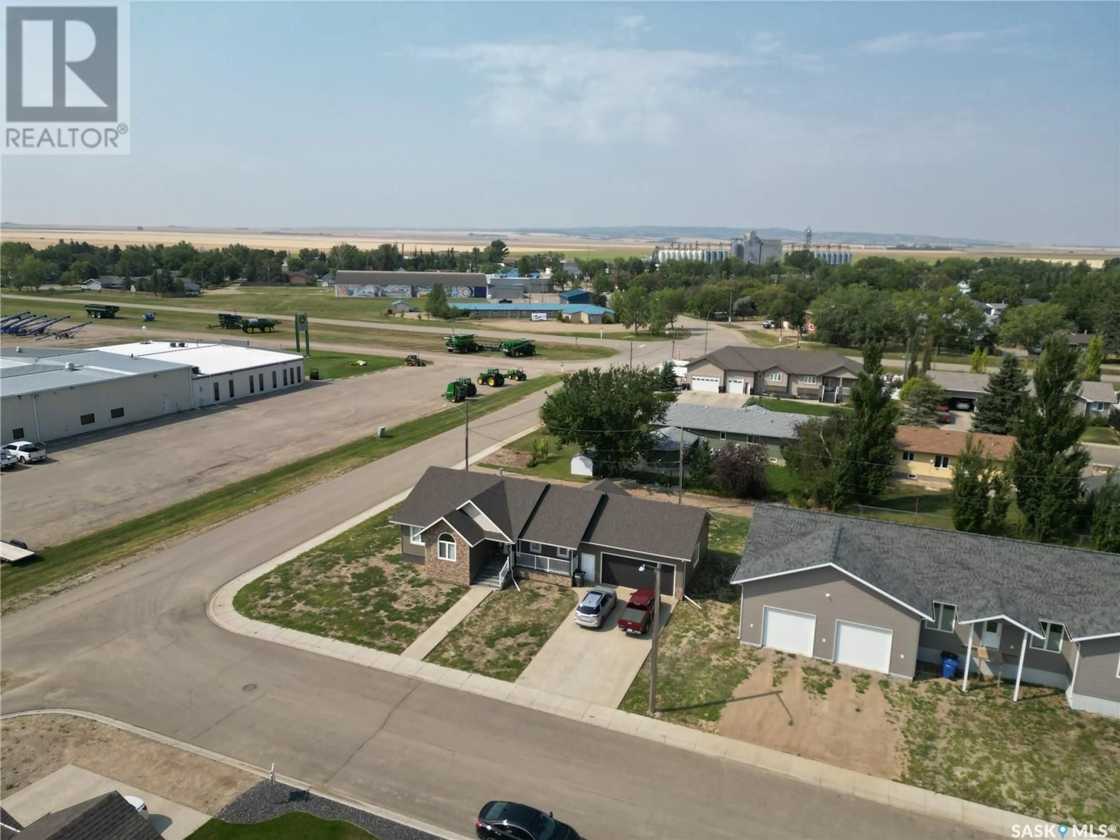 Living room with furniture, wood/laminate floor for 44 CRESCENT DRIVE, Avonlea Saskatchewan S0H0C0