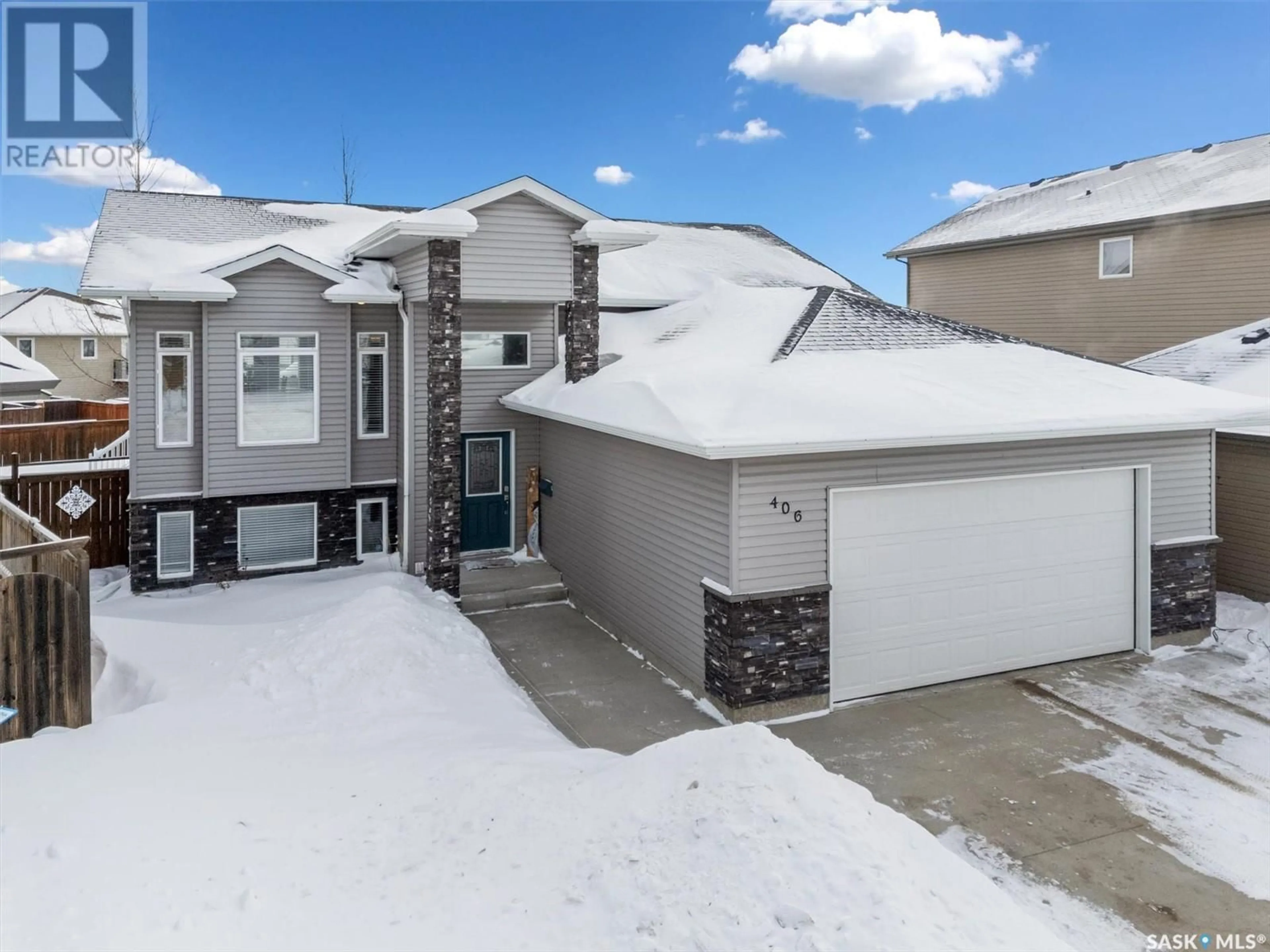 A pic from outside/outdoor area/front of a property/back of a property/a pic from drone, street for 406 Quessy DRIVE, Martensville Saskatchewan S0K0A2