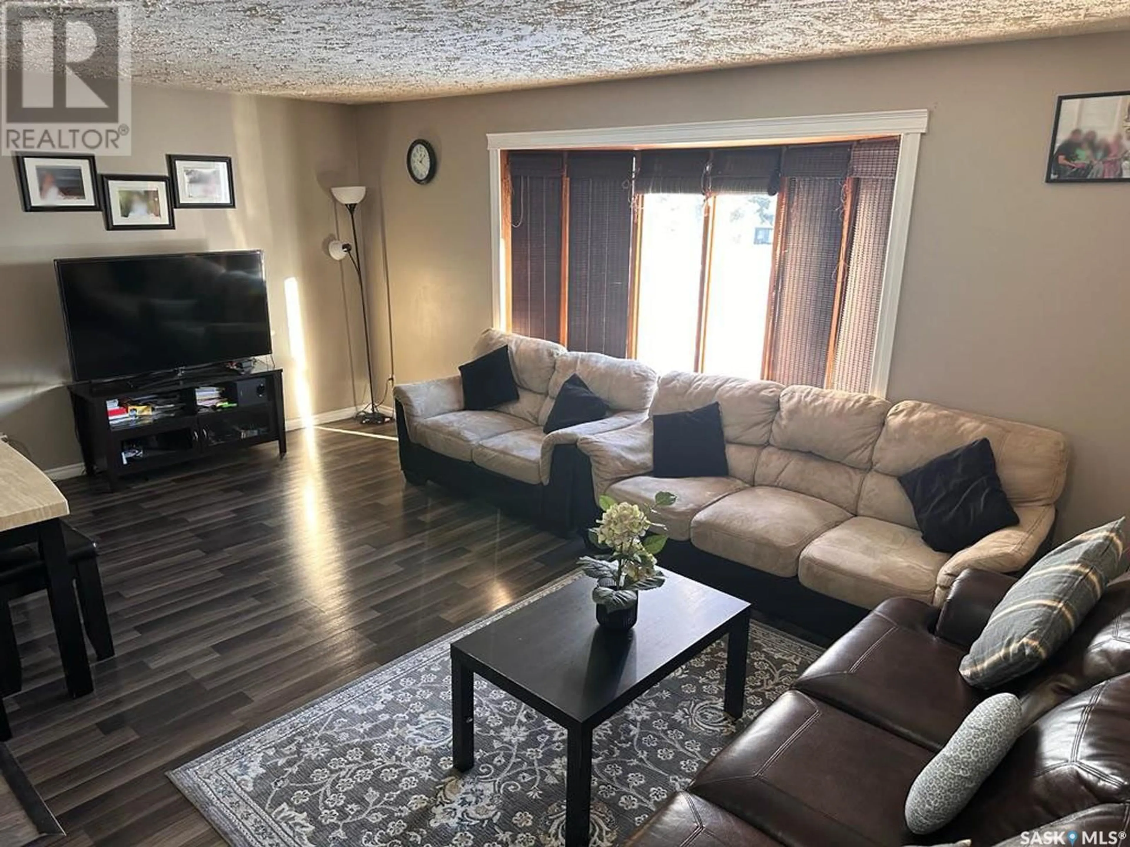 Living room with furniture, wood/laminate floor for 609 2ND STREET, Meadow Lake Saskatchewan S9X1Y9