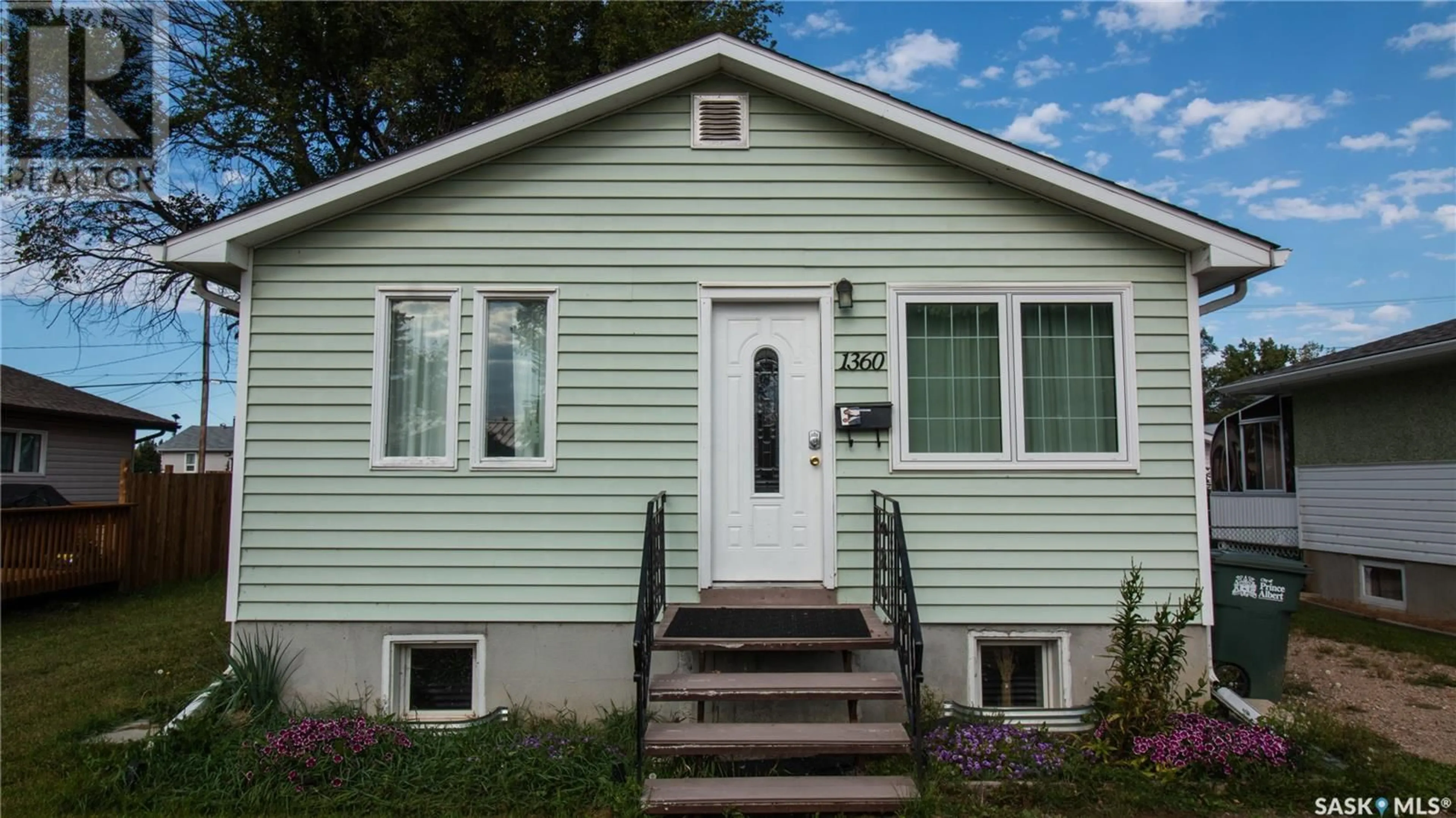 Home with vinyl exterior material, street for 1360 1360 1st STREET, Prince Albert Saskatchewan S6V0E3