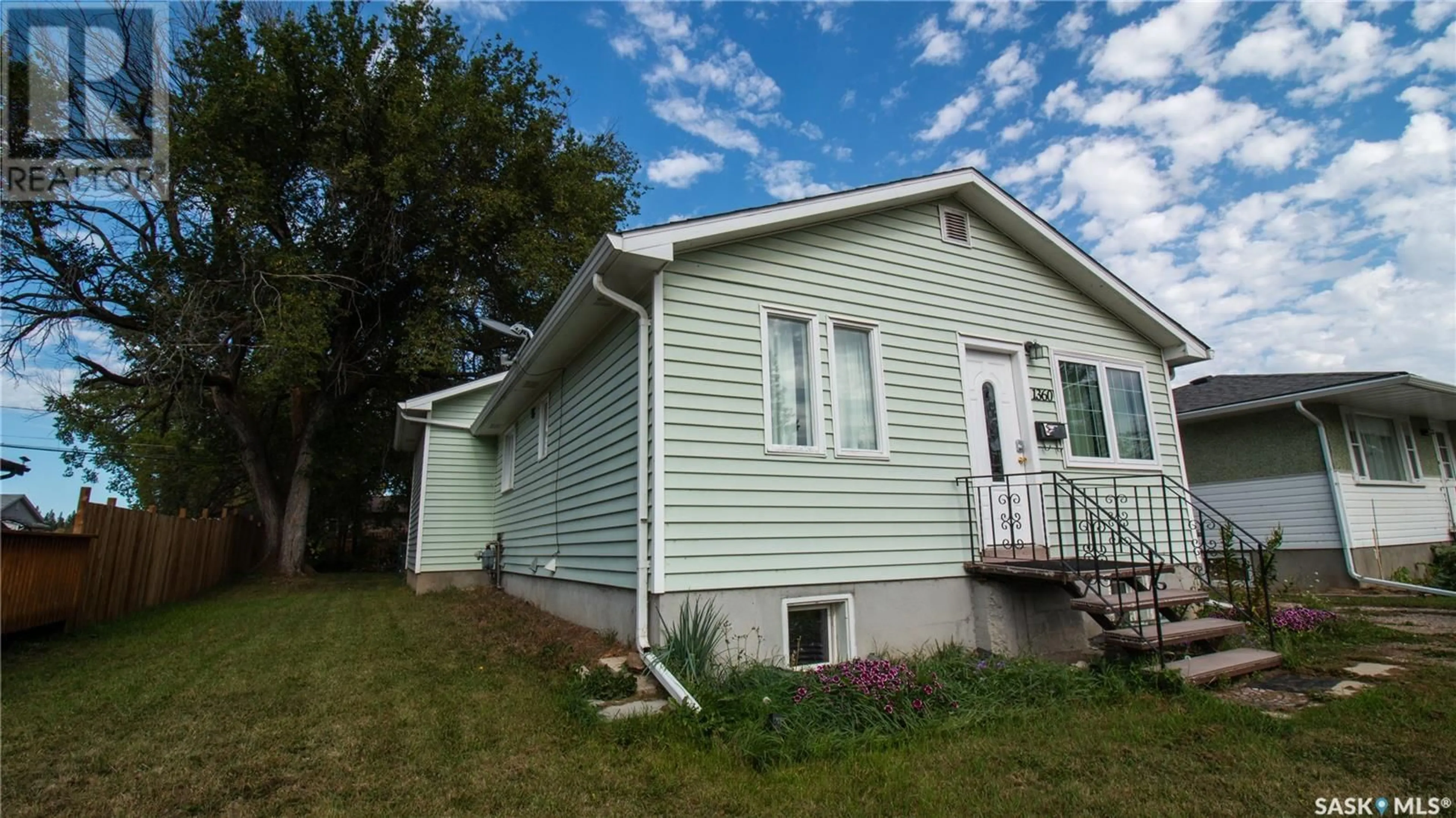 Home with vinyl exterior material, street for 1360 1360 1st STREET, Prince Albert Saskatchewan S6V0E3