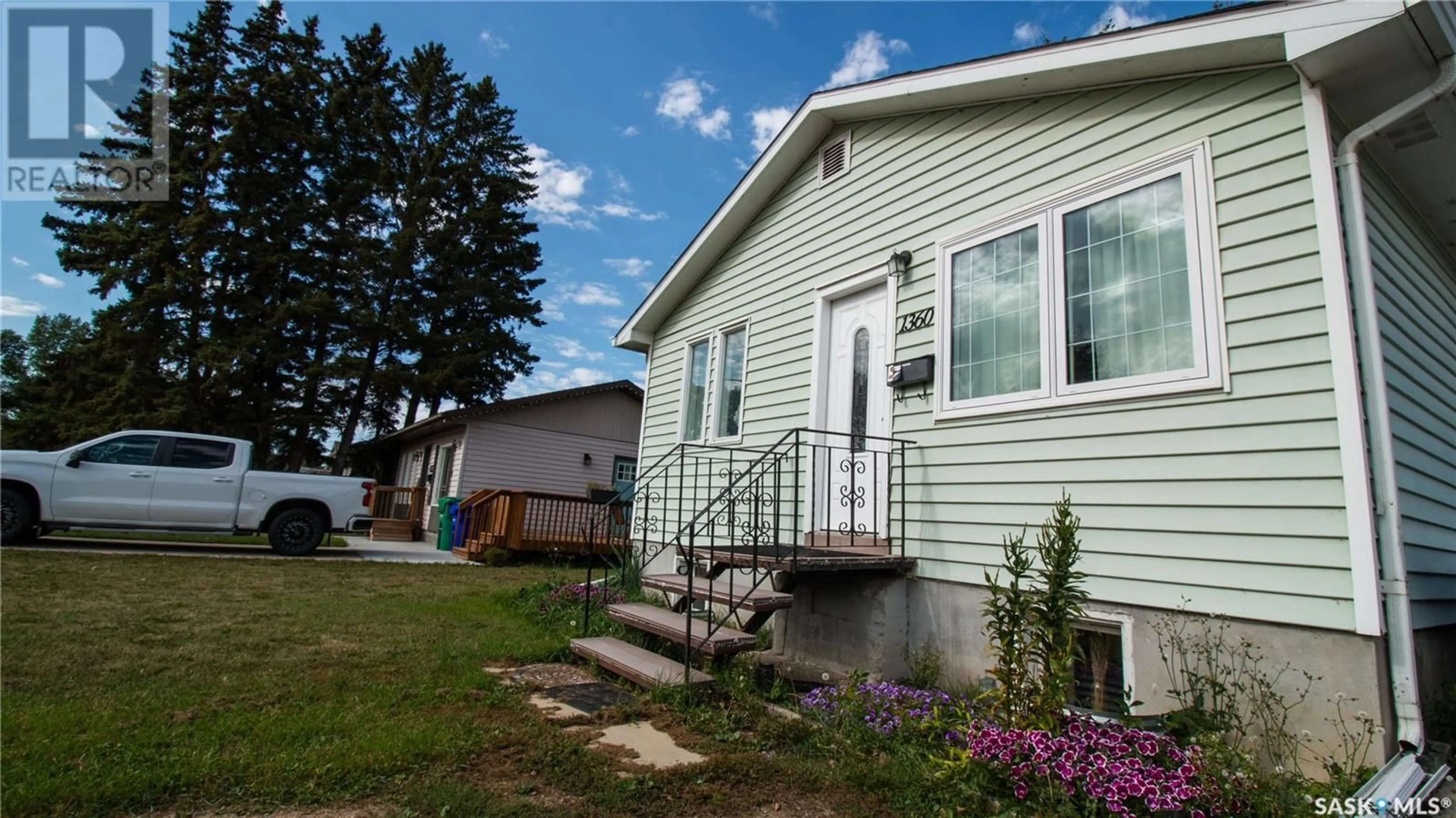 Home with vinyl exterior material, street for 1360 1360 1st STREET, Prince Albert Saskatchewan S6V0E3