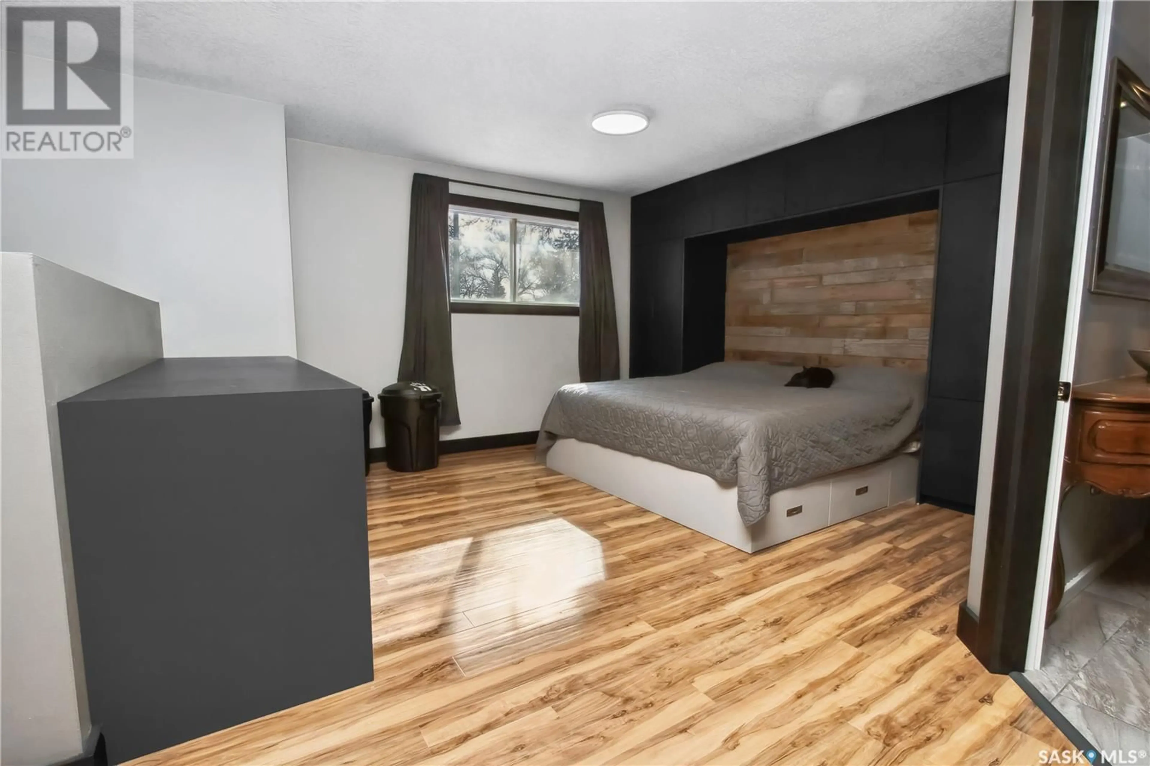 Bedroom with bed, wood/laminate floor for 726 McCarthy BOULEVARD, Regina Saskatchewan S4T6V7