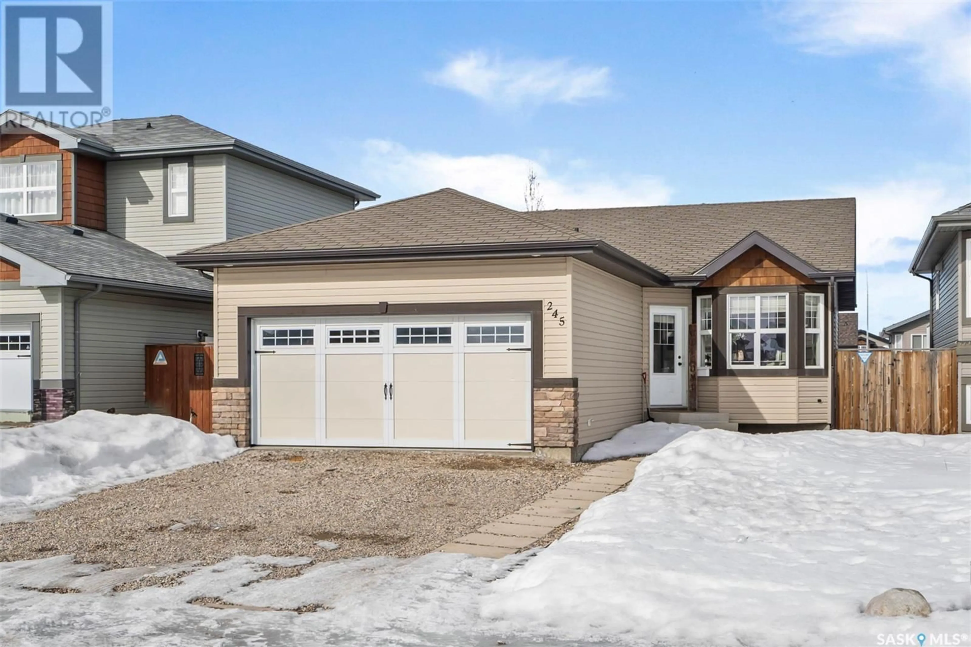 Home with vinyl exterior material, street for 245 Enns CRESCENT, Martensville Saskatchewan S0K0A2