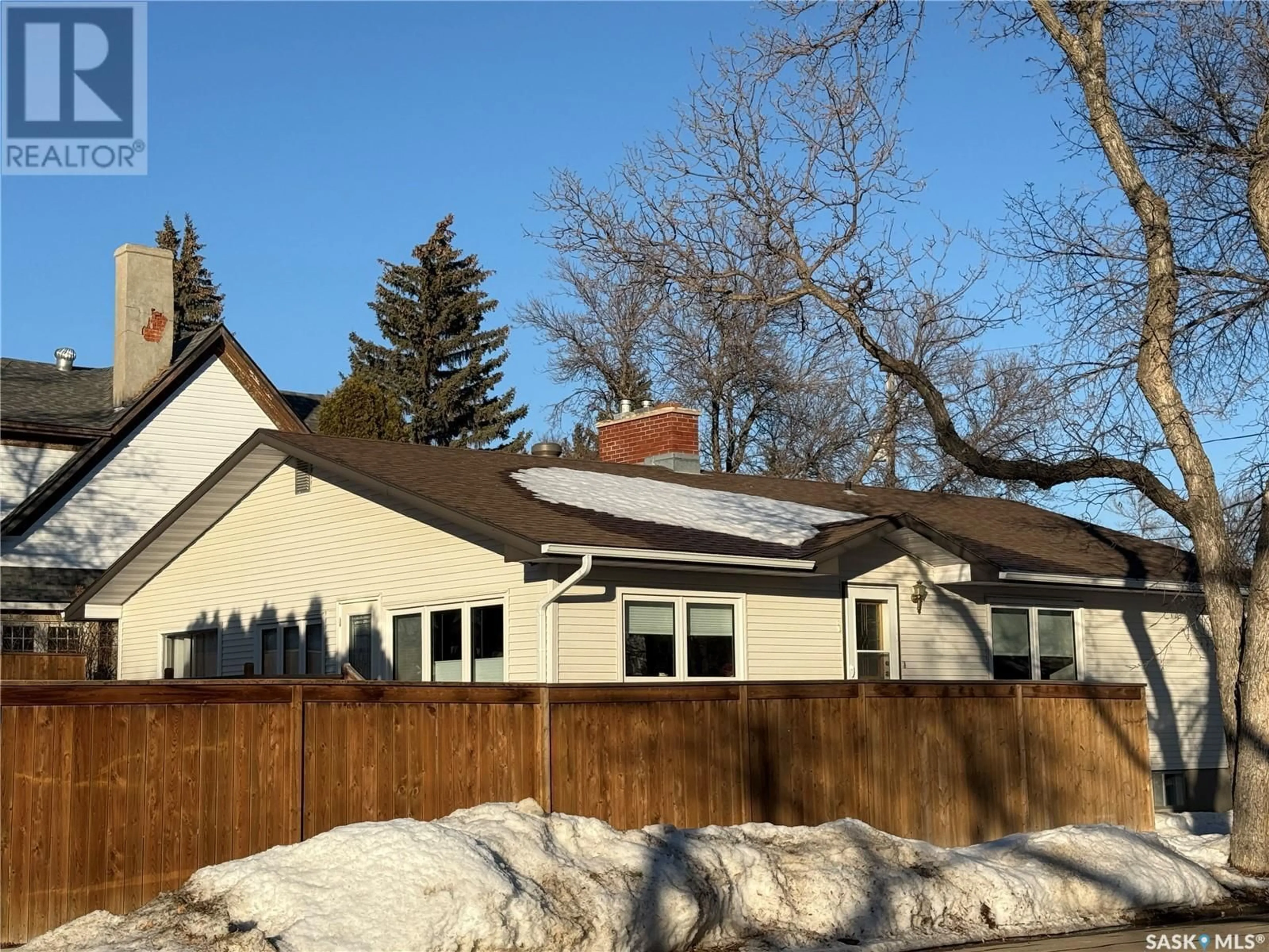 Home with vinyl exterior material, street for 401 5th STREET NE, Weyburn Saskatchewan S4H0Z7