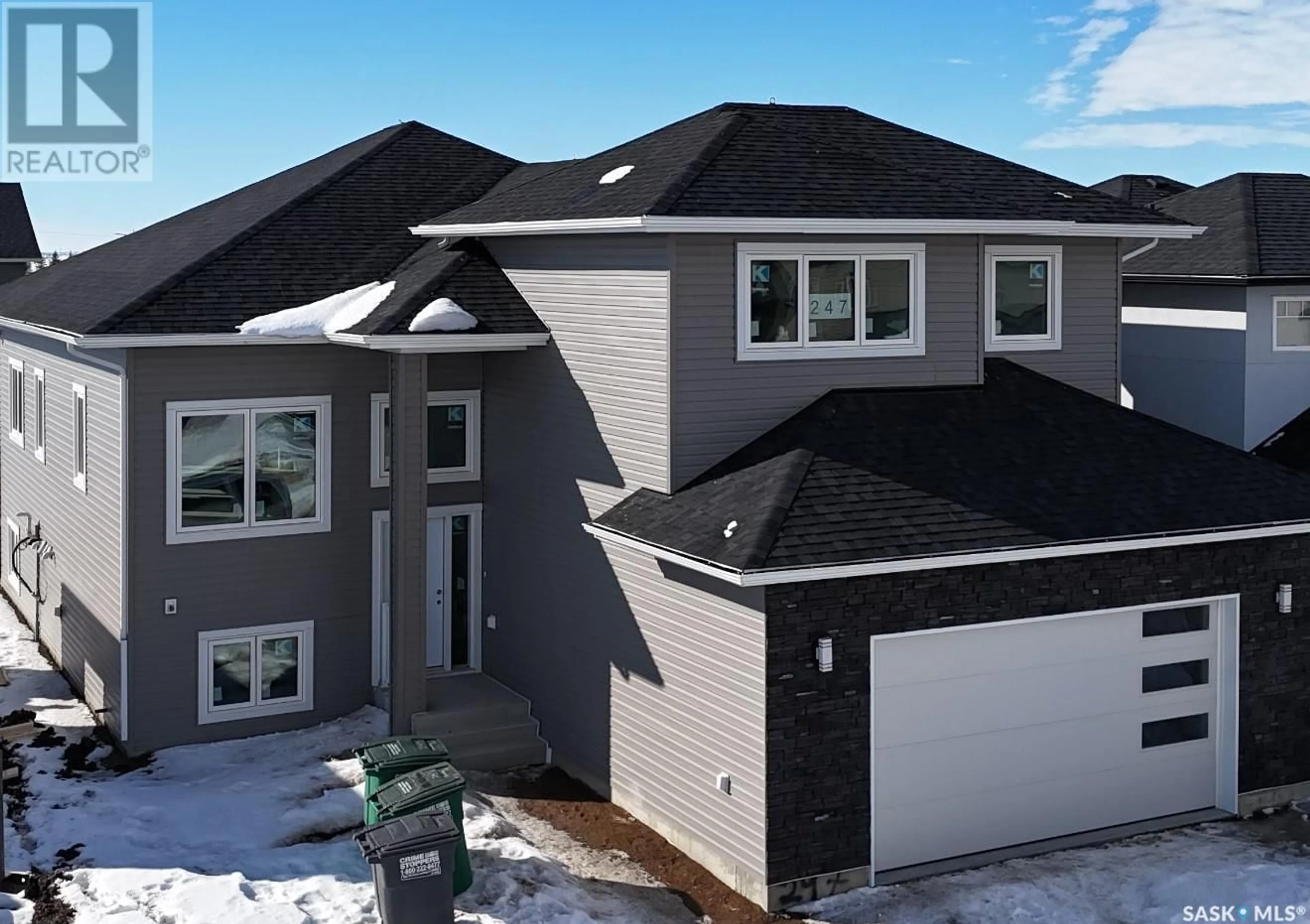 Home with vinyl exterior material, street for 247 Stromberg COURT, Saskatoon Saskatchewan S7L6M9