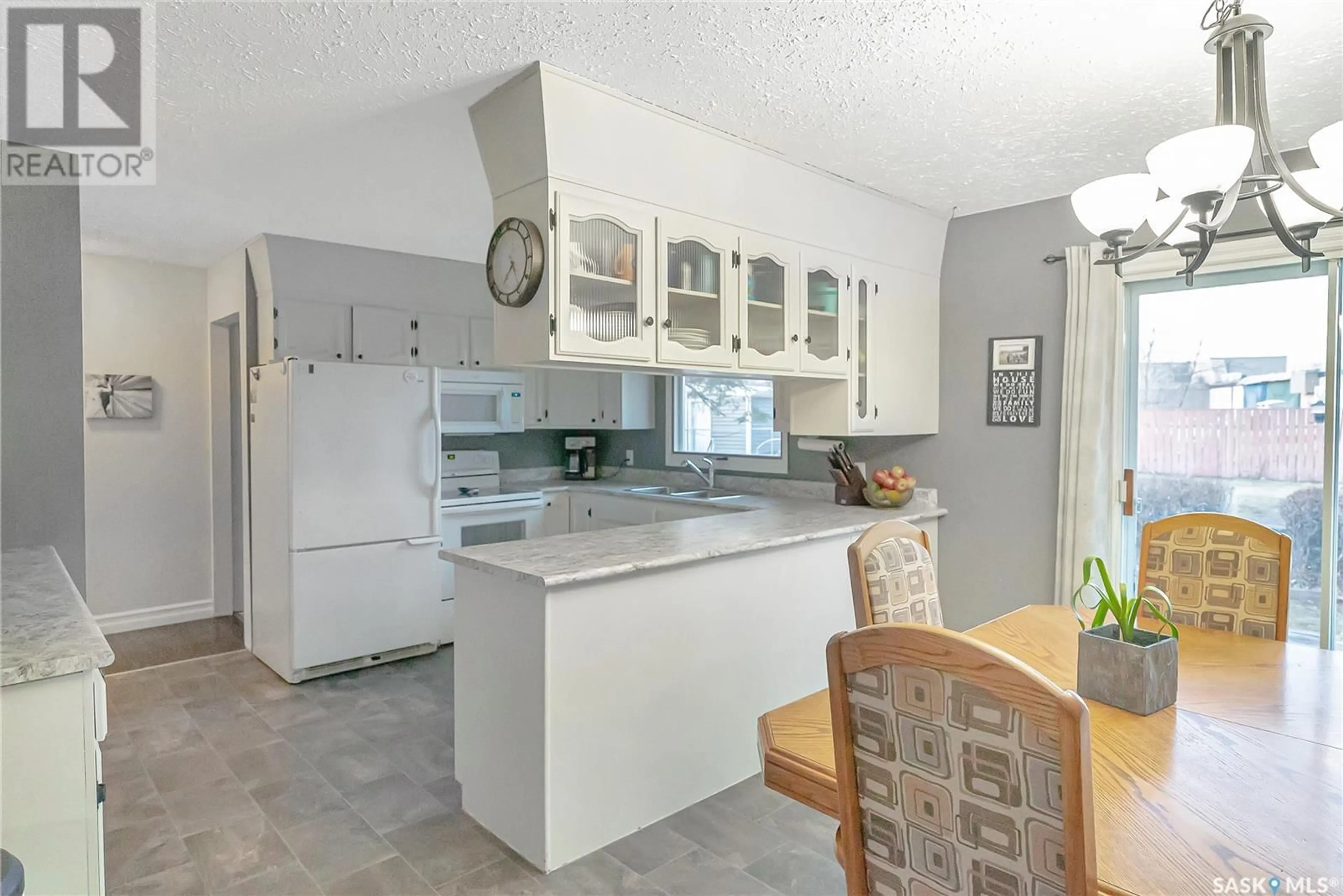 Open concept kitchen, ceramic/tile floor for 9705 97TH DRIVE, North Battleford Saskatchewan S9A3K3