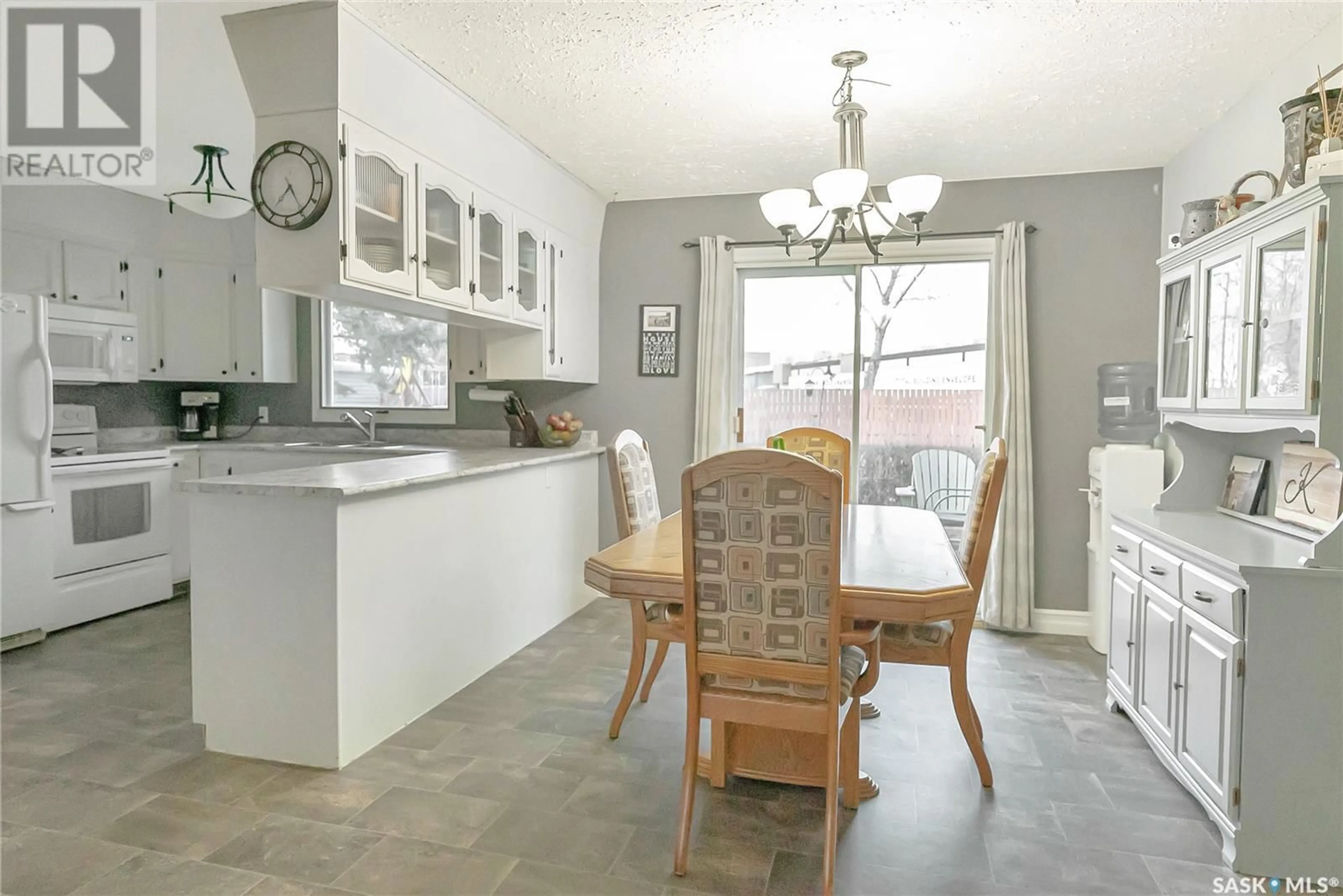 Open concept kitchen, ceramic/tile floor for 9705 97TH DRIVE, North Battleford Saskatchewan S9A3K3