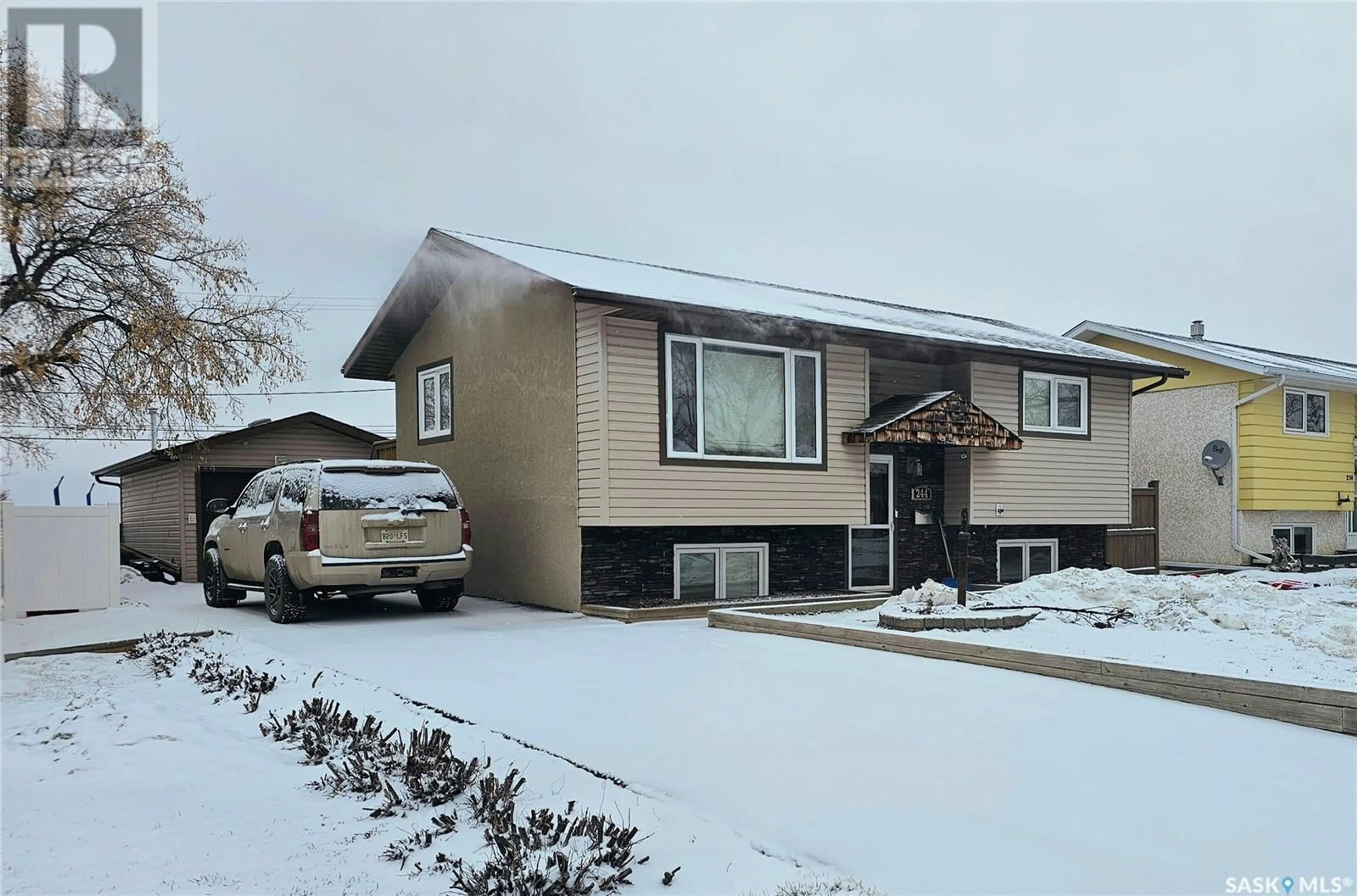 Home with vinyl exterior material, street for 244 1st AVENUE SW, Swift Current Saskatchewan S9H3H3