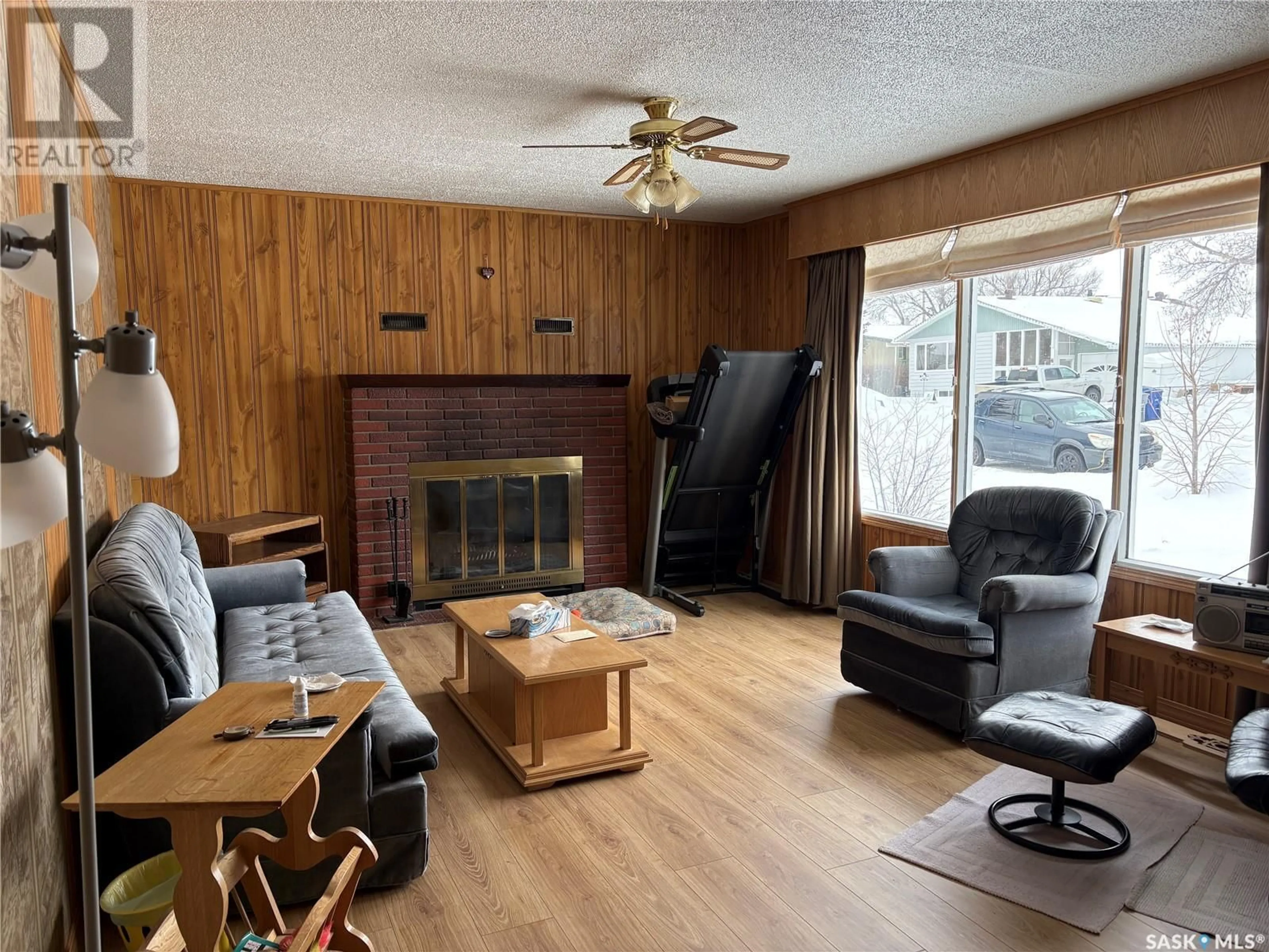 Living room with furniture, wood/laminate floor for 304 3RD STREET, Cabri Saskatchewan S0N0J0