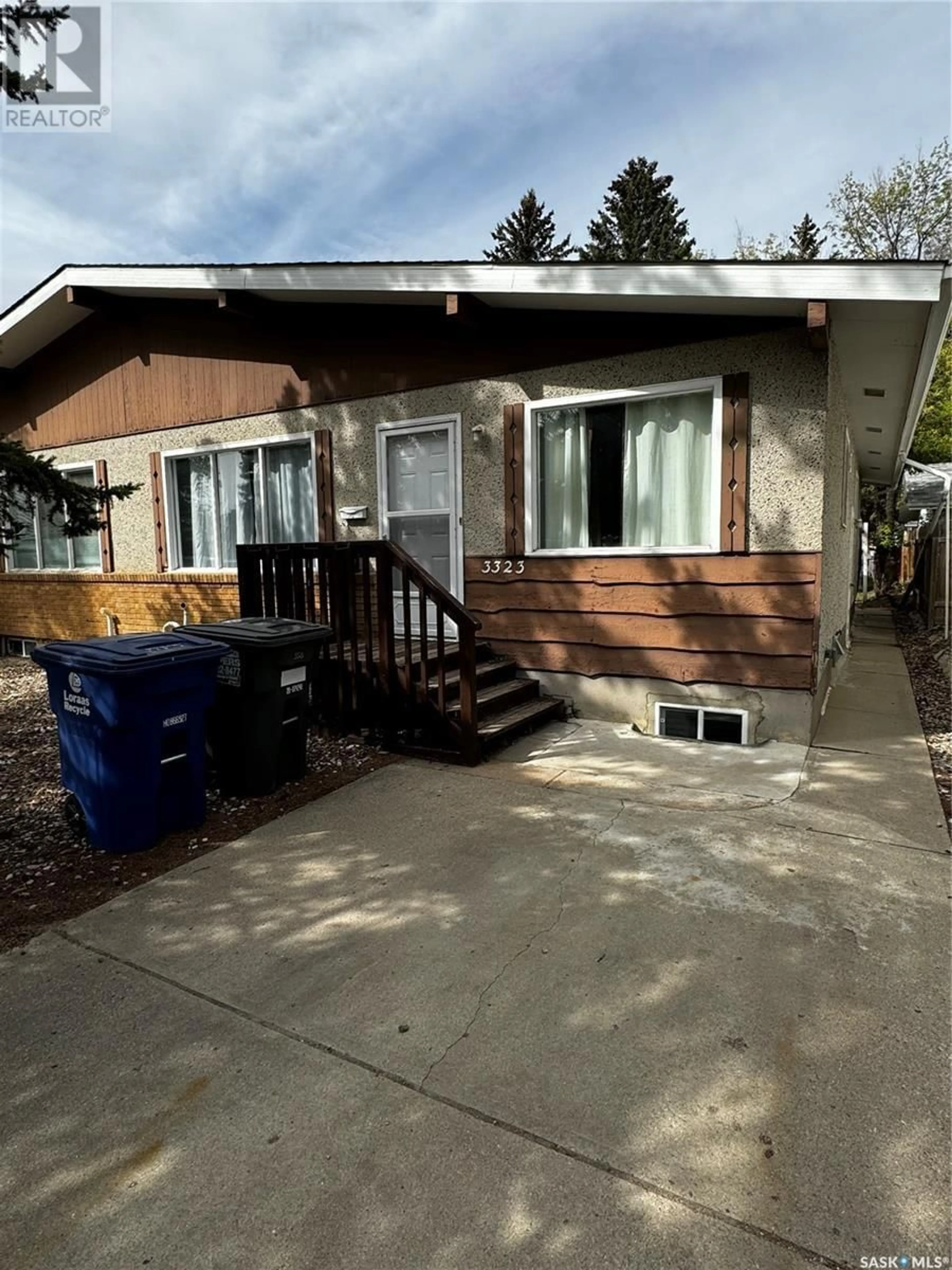 Home with vinyl exterior material, street for 3323 14th STREET E, Saskatoon Saskatchewan S7H0B5