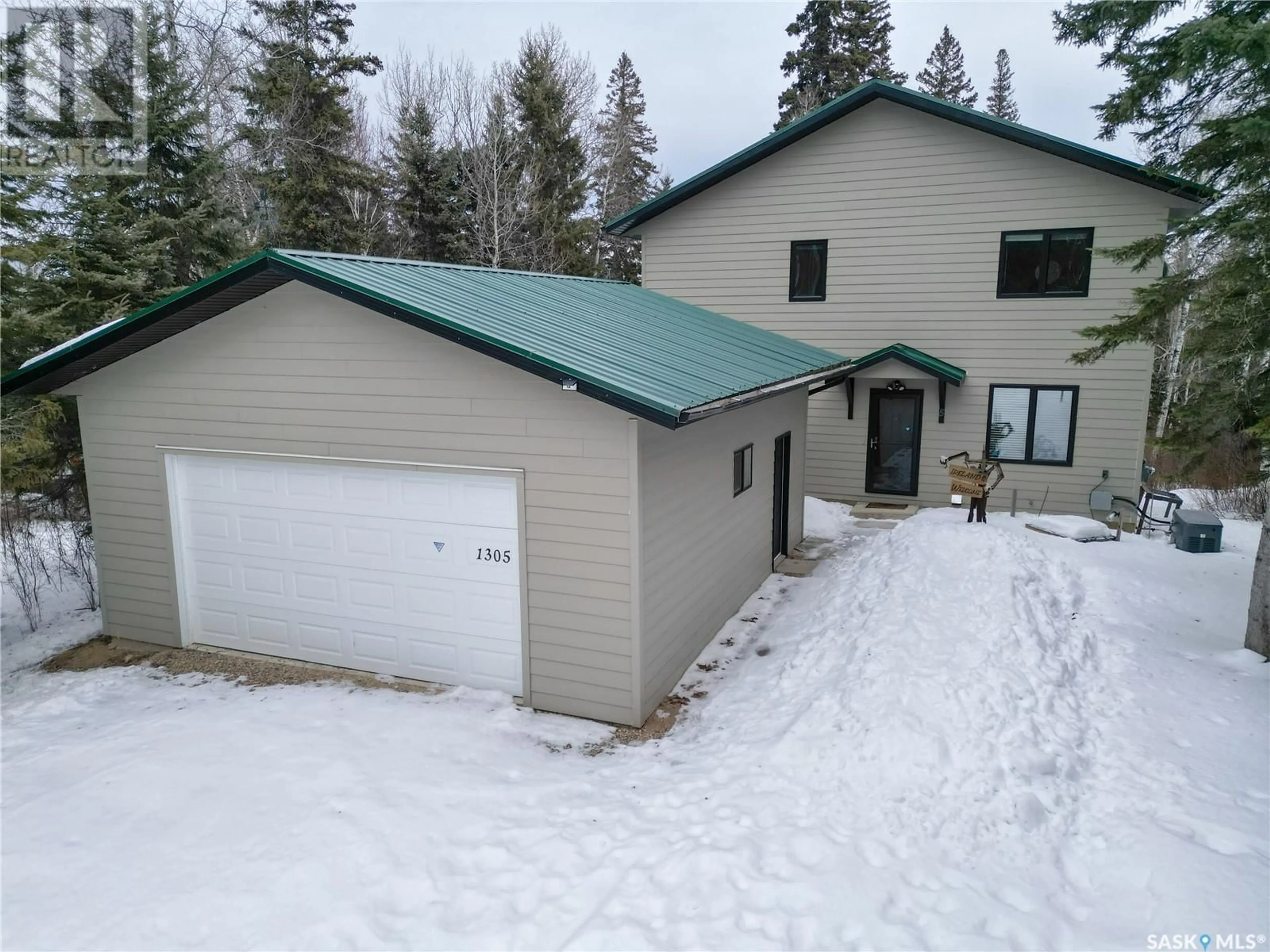 A pic from outside/outdoor area/front of a property/back of a property/a pic from drone, water/lake/river/ocean view for 1305 LAURIE PLACE, Paddockwood Rm No. 520 Saskatchewan S0J0N0
