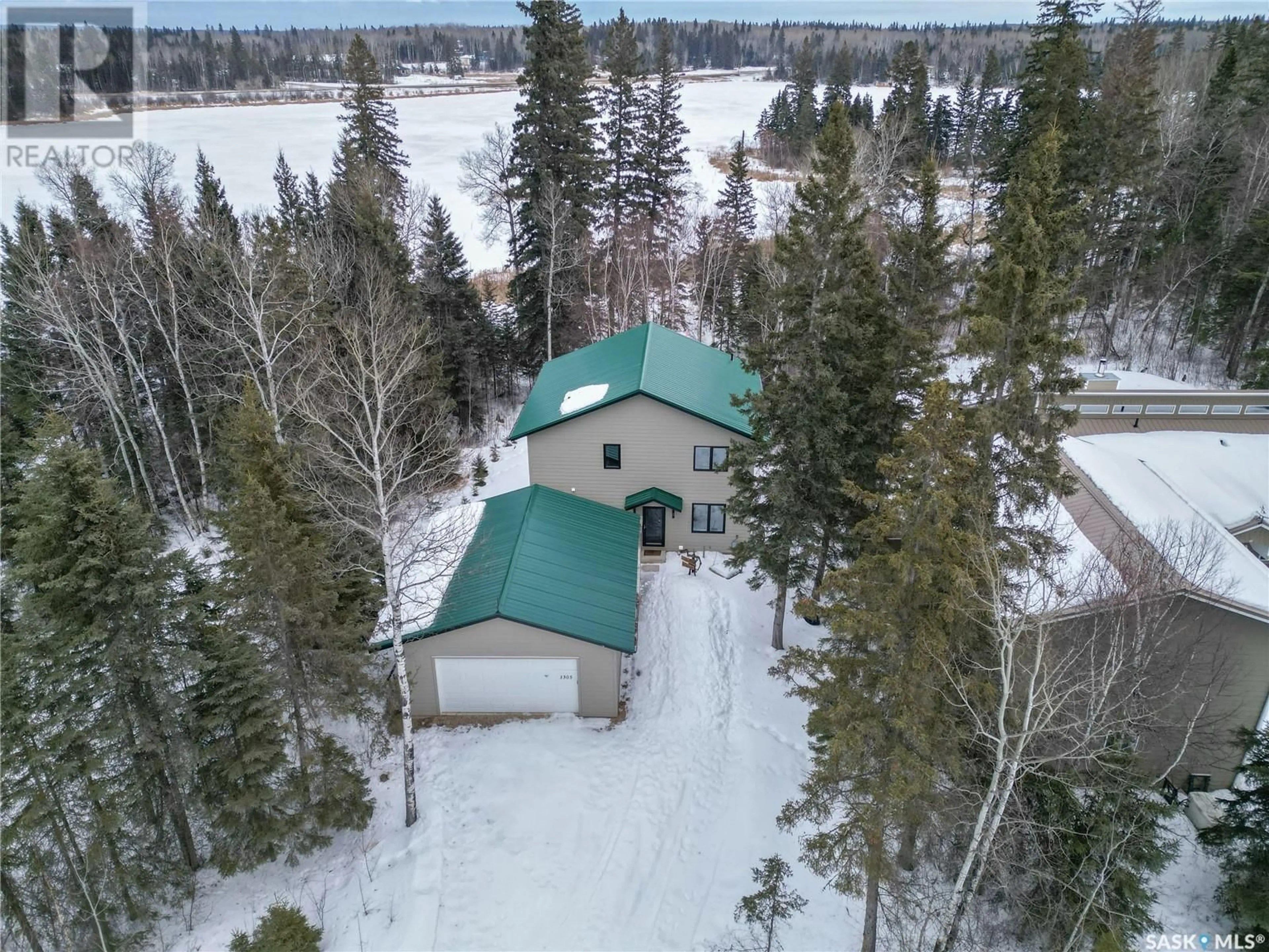 A pic from outside/outdoor area/front of a property/back of a property/a pic from drone, unknown for 1305 Laurie PLACE, Emma Lake Saskatchewan S0J0N0