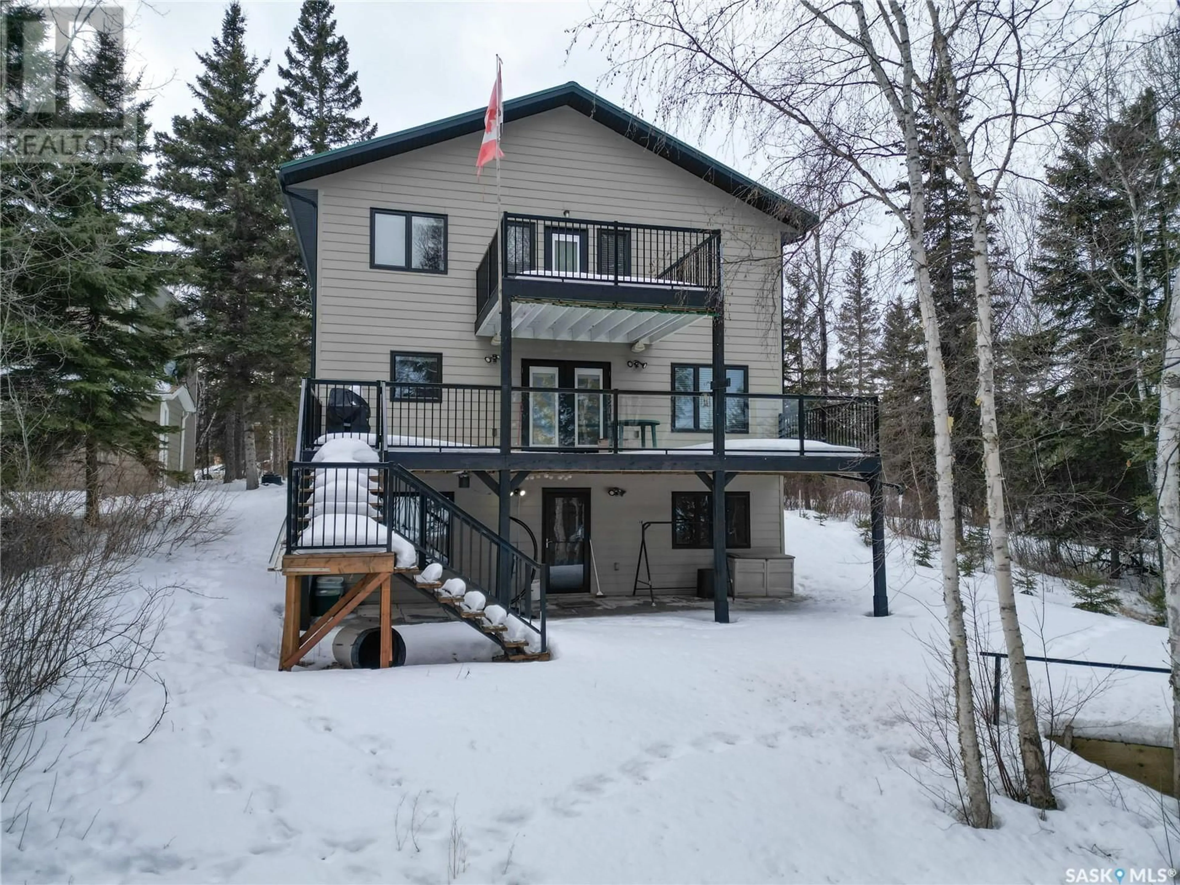 A pic from outside/outdoor area/front of a property/back of a property/a pic from drone, unknown for 1305 Laurie PLACE, Emma Lake Saskatchewan S0J0N0