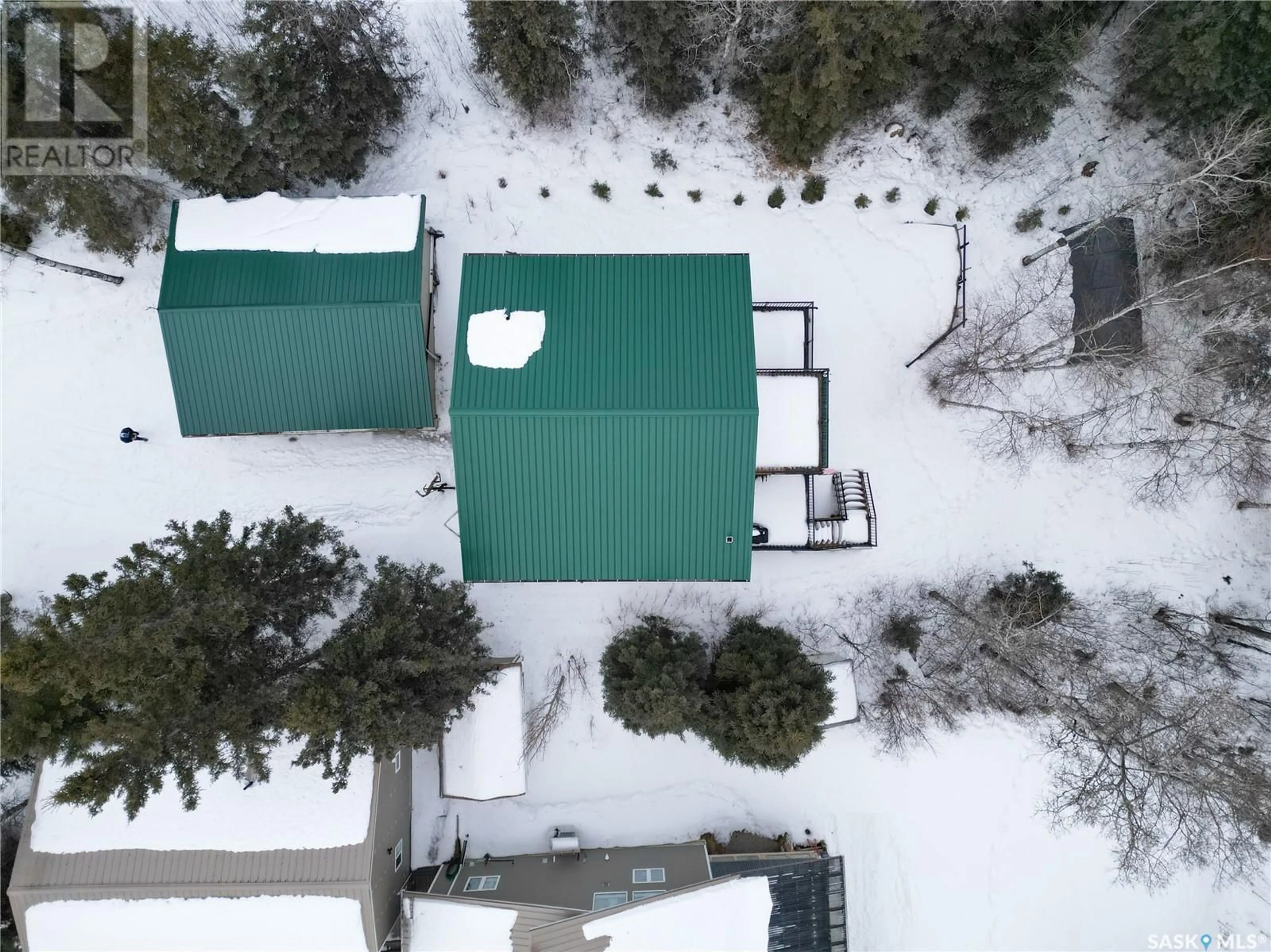 A pic from outside/outdoor area/front of a property/back of a property/a pic from drone, building for 1305 Laurie PLACE, Emma Lake Saskatchewan S0J0N0