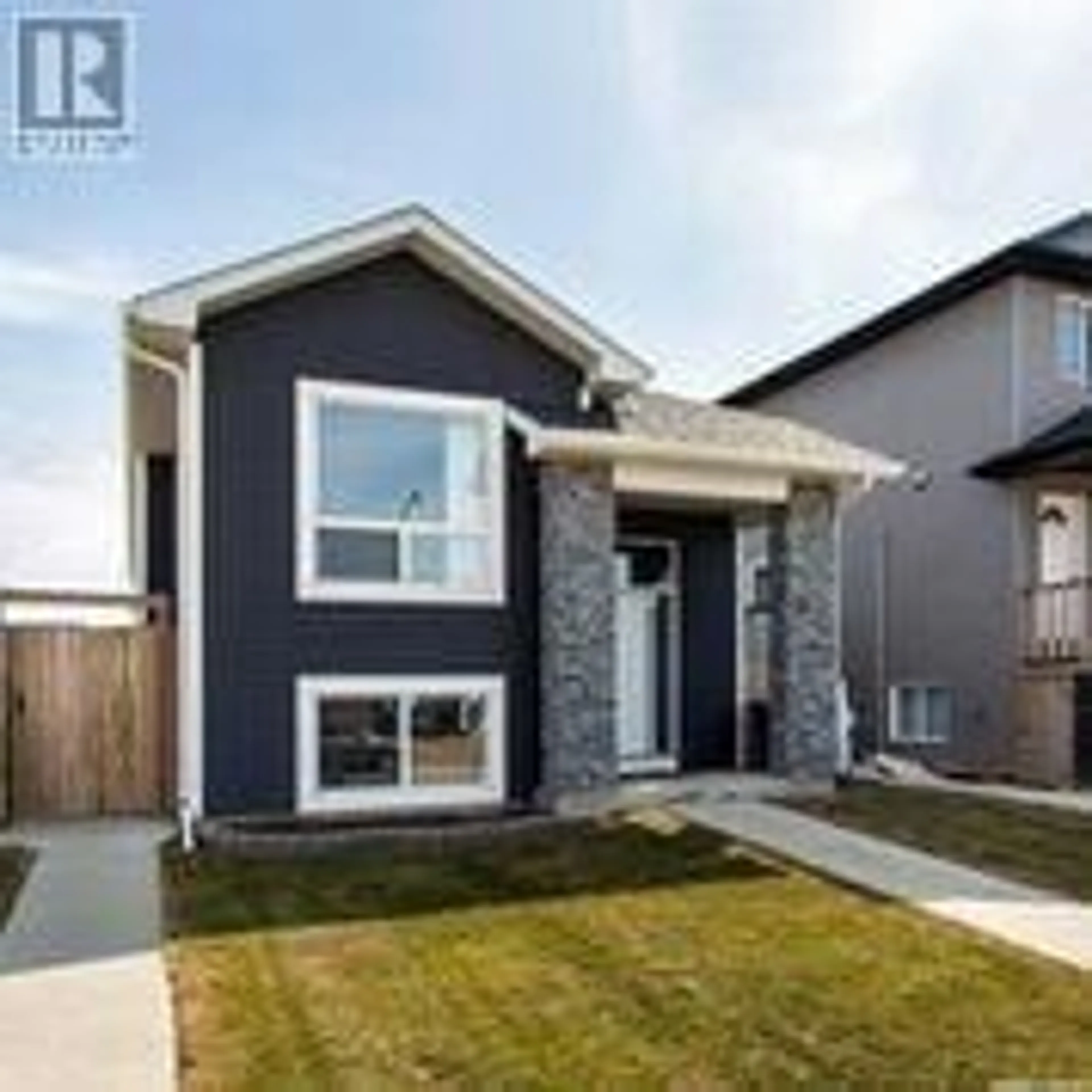 Home with vinyl exterior material, street for 310 Rosewood BOULEVARD W, Saskatoon Saskatchewan S7V0G9