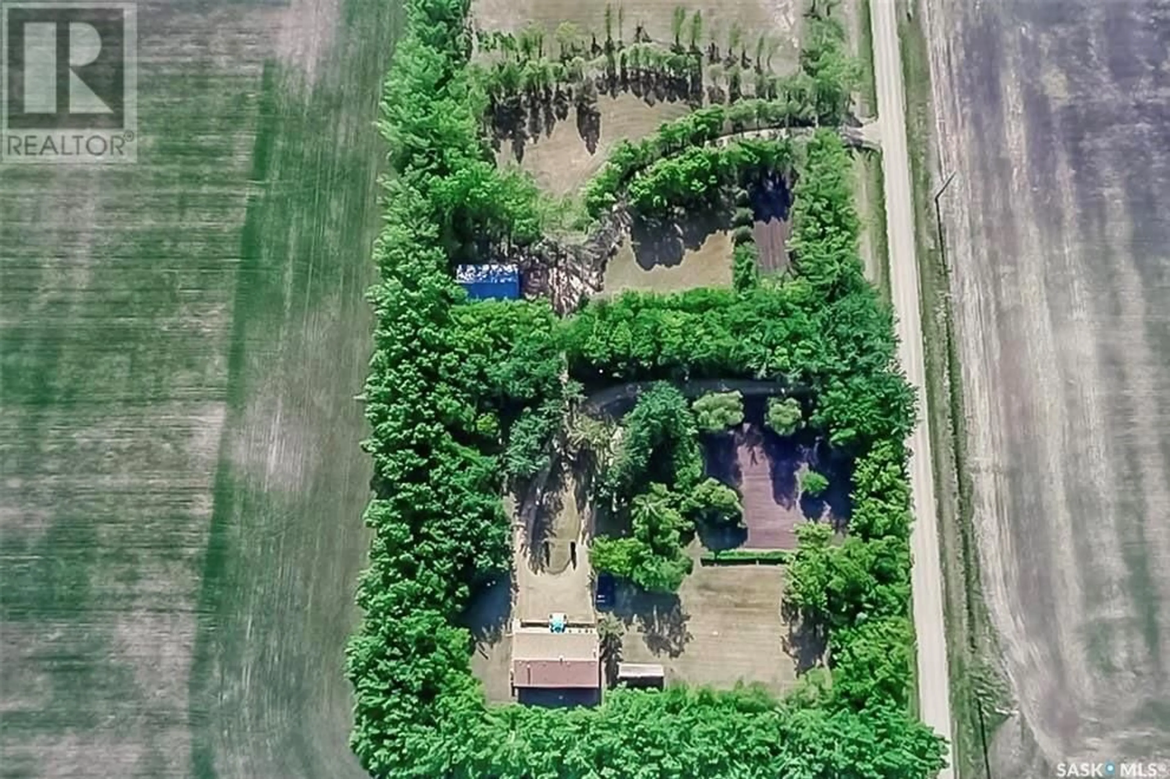 A pic from outside/outdoor area/front of a property/back of a property/a pic from drone, forest/trees view for Watson Acreage, Watson Saskatchewan S0K4V0