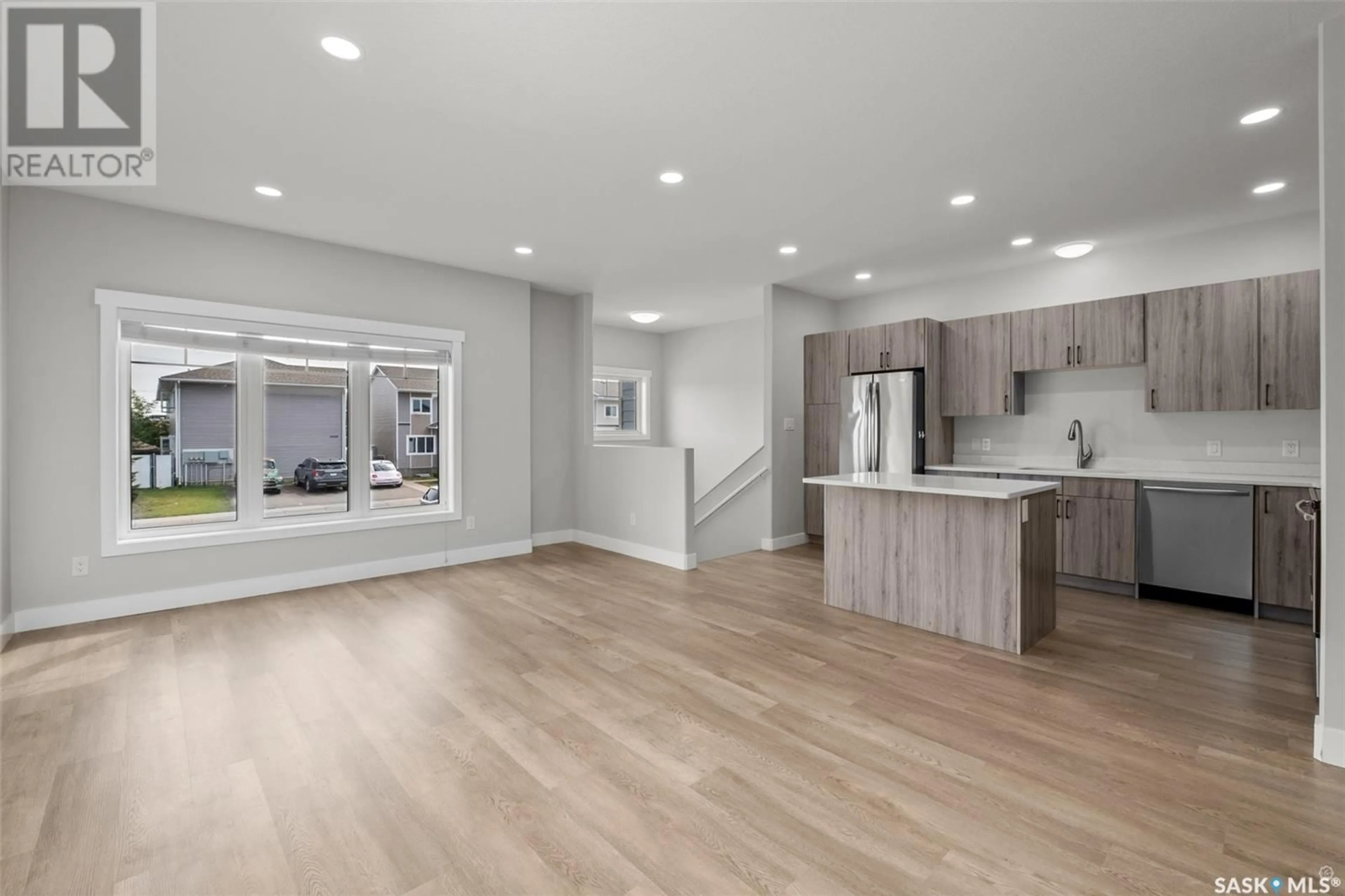 Open concept kitchen, wood/laminate floor for 3003/3009 5A AVENUE, Prince Albert Saskatchewan S6V7K4