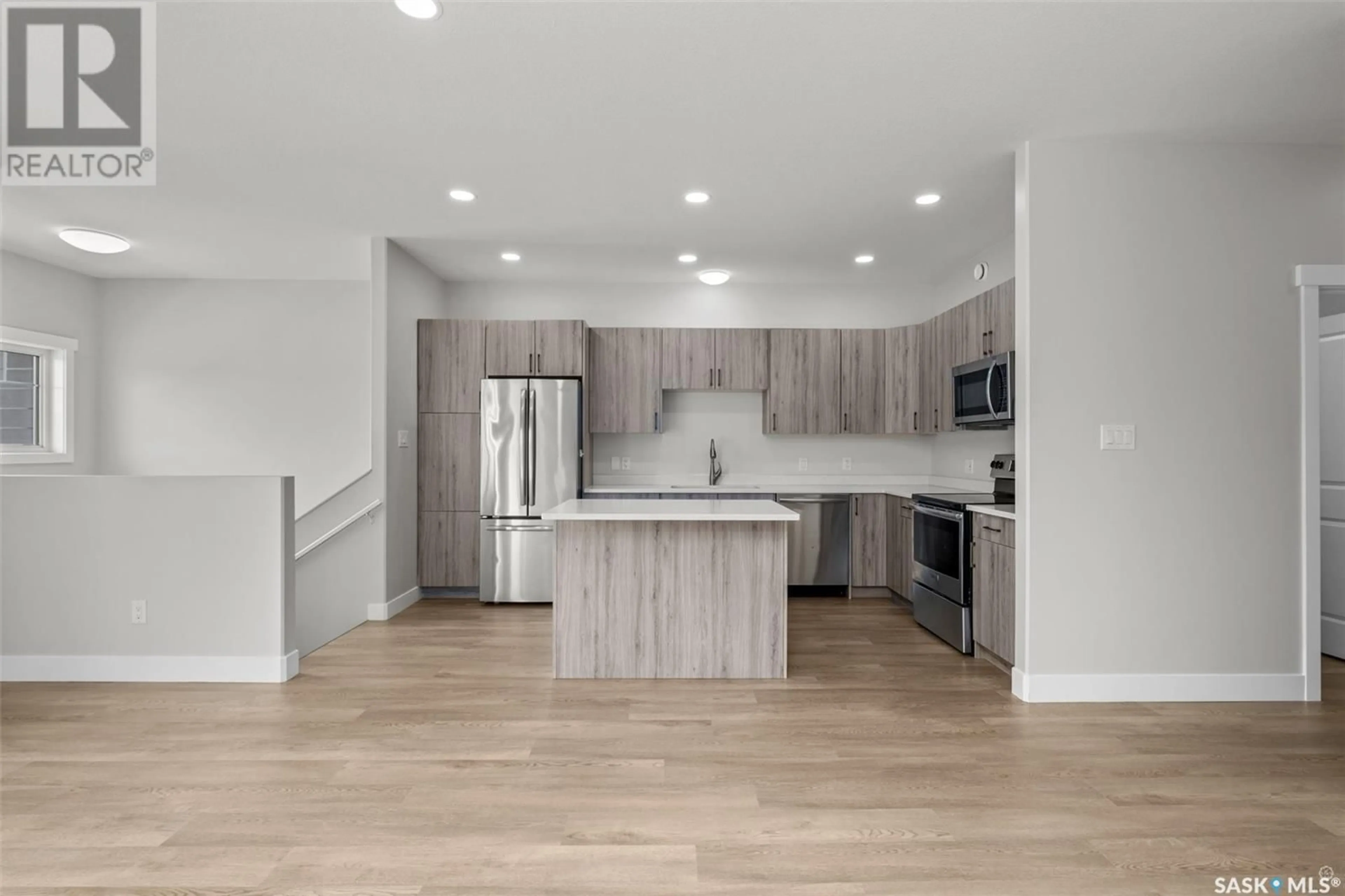 Open concept kitchen, wood/laminate floor for 3003/3009 5A AVENUE, Prince Albert Saskatchewan S6V7K4