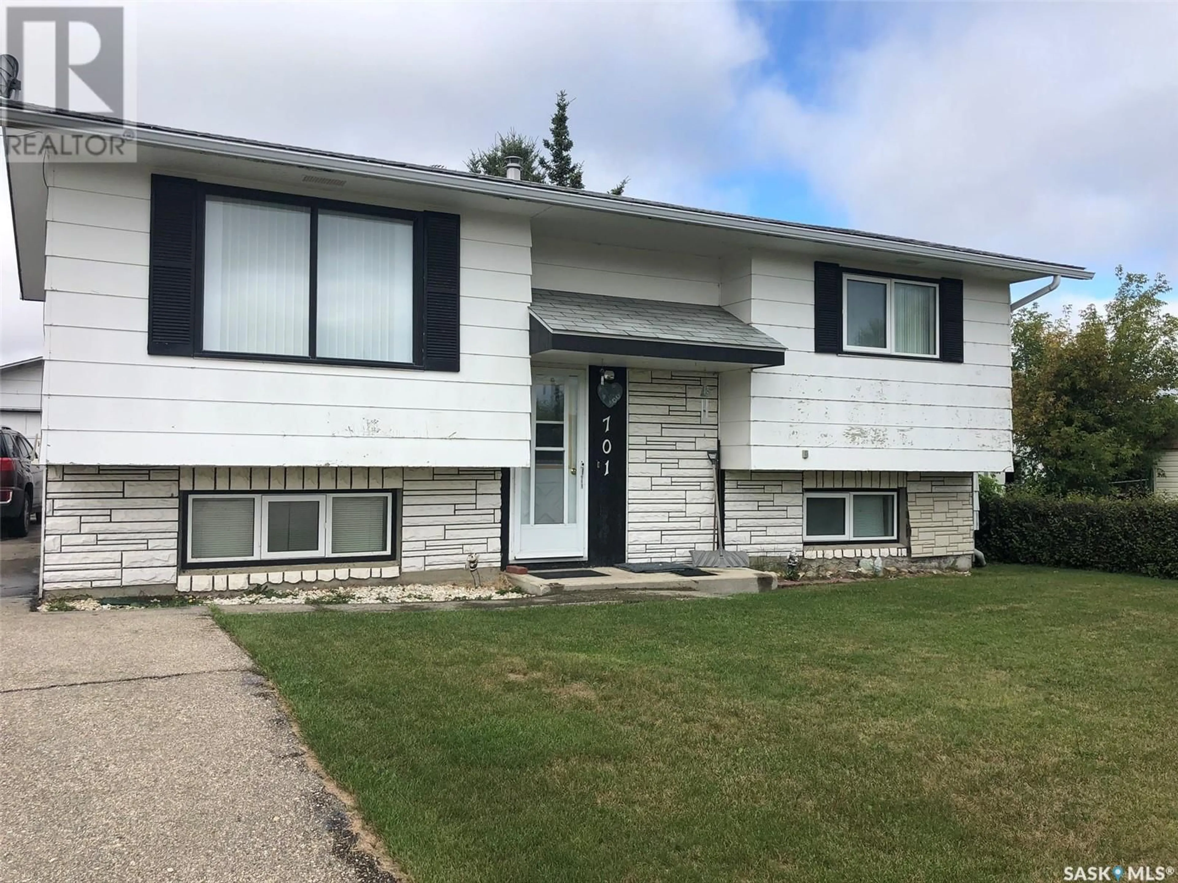 Home with vinyl exterior material, street for 701 HUDSON CRESCENT, Hudson Bay Saskatchewan S0E0Y0