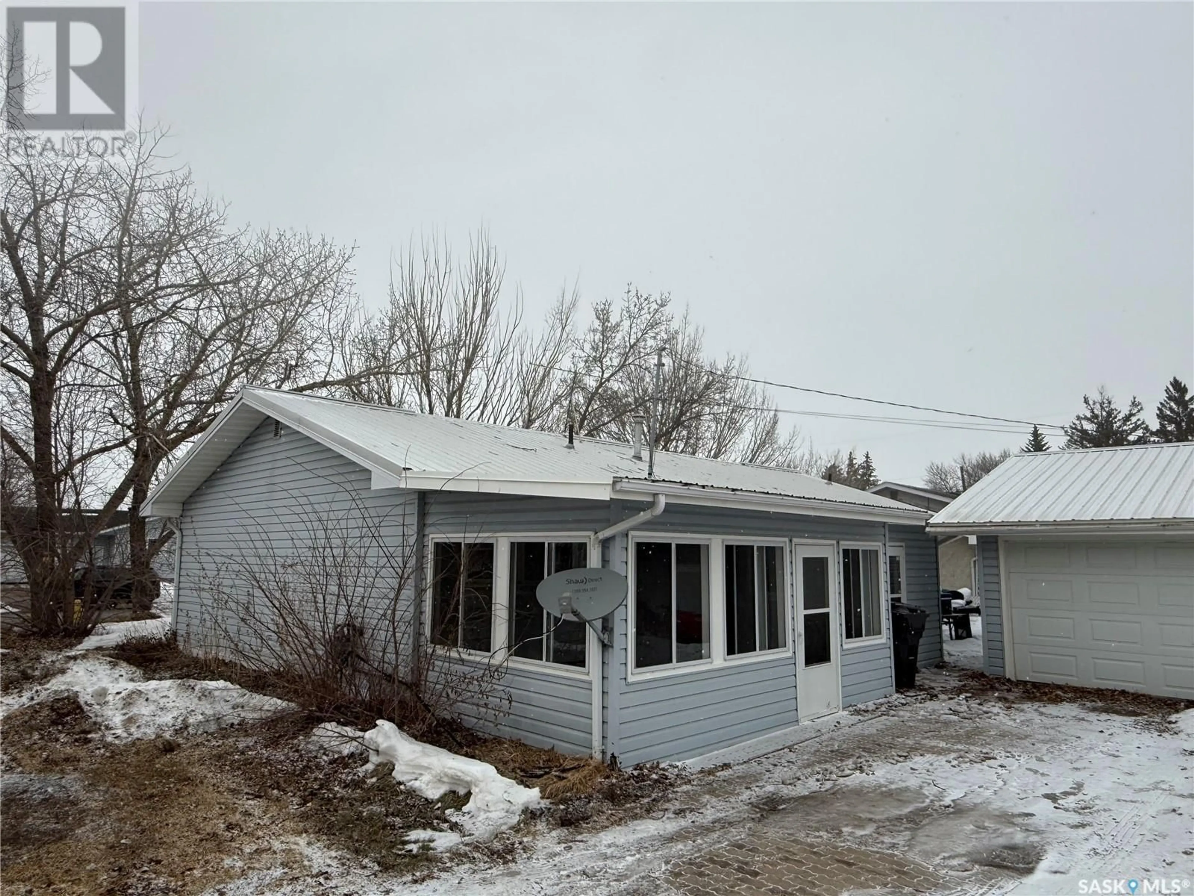 Home with vinyl exterior material, street for 323 HEWARD STREET, Stoughton Saskatchewan S0G4T0